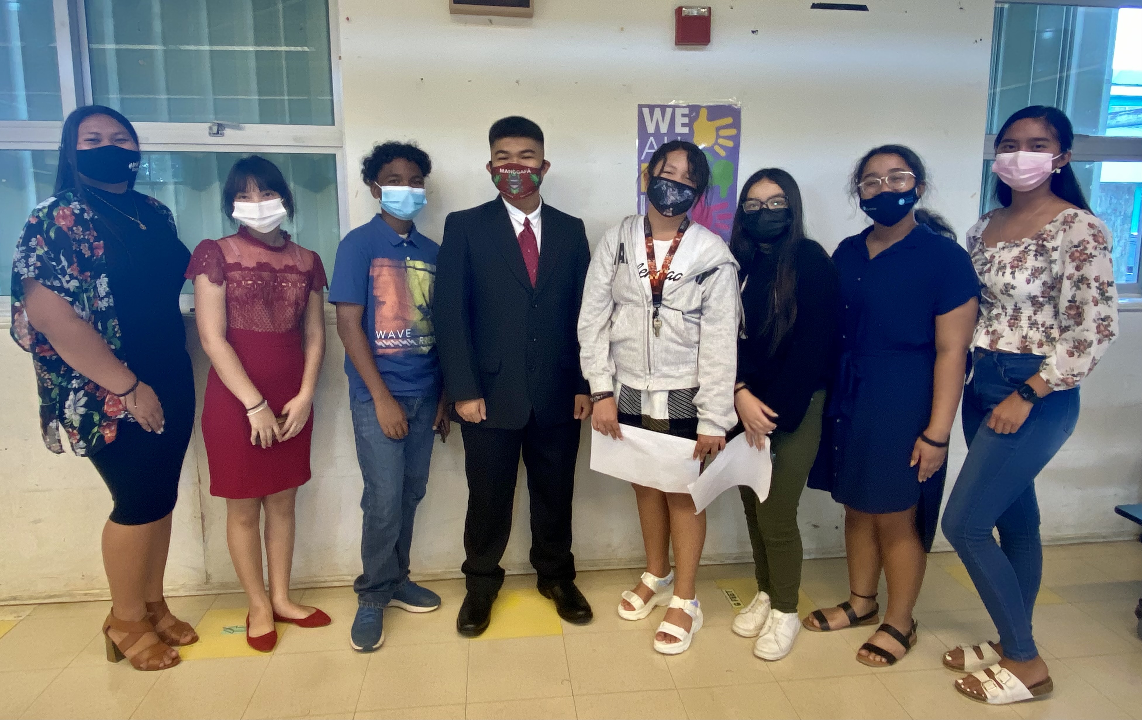 Student Rep. Jed Santa Theresa, fourth left, poses for a photo with Rita H. Inos  Jr.-Sr. High School Youth Advisory Panel leaders: Bea Bermeo, Danica Malaborbor, Bernard Takawo, Angel Fajardo, Kassidy Garces, and Chloe Yalung.