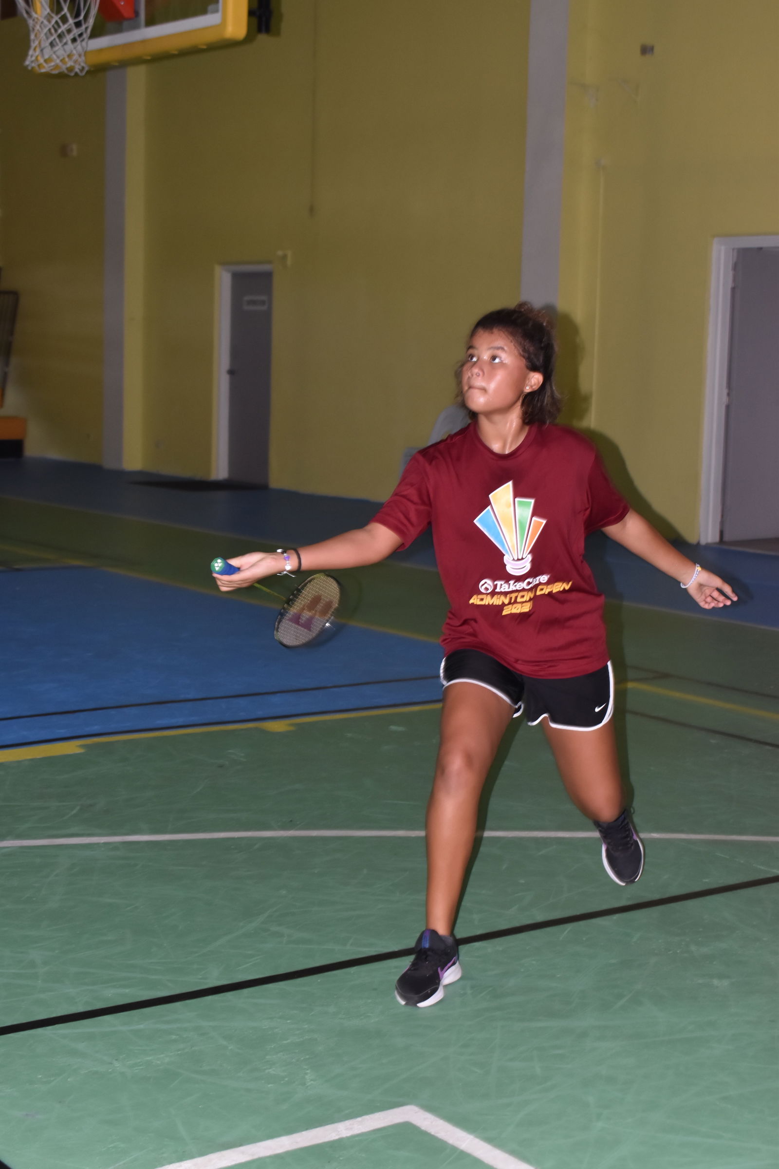 Kaya Braxton attempts the forehand return during  Monday's championship game of the TakeCare Badminton Open Junior Division at the Ada gym.