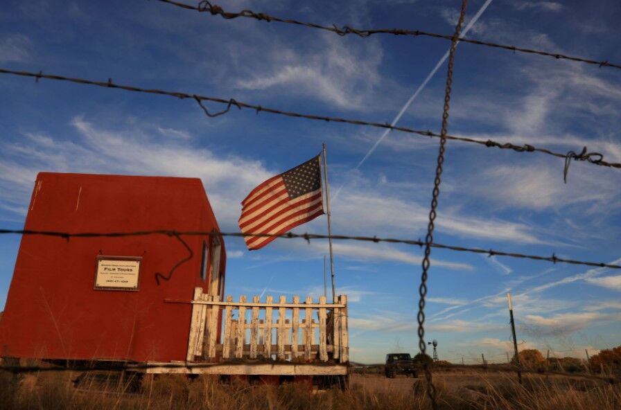The entrance to the film set of "Rust" is seen through a barbed wire fence after Hollywood actor Alec Baldwin fatally shot a cinematographer and wounded a director when he discharged a prop gun on the movie set in Santa Fe, New Mexico.