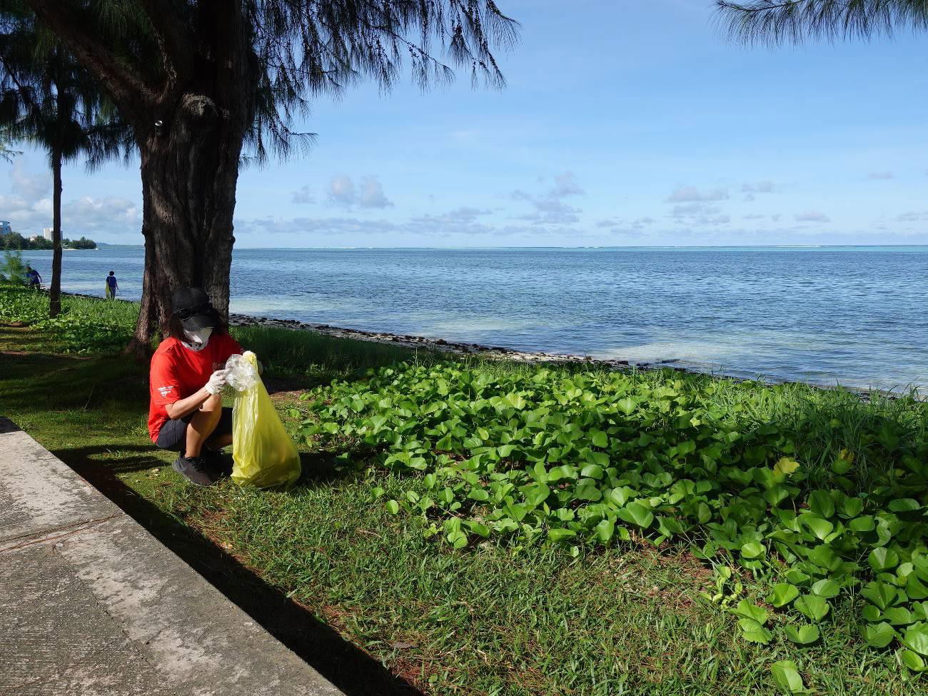 Katsuko Takahashi participates in a beach cleanup in Saipan on Sept. 27, 2021, in celebration of World Tourism Day.