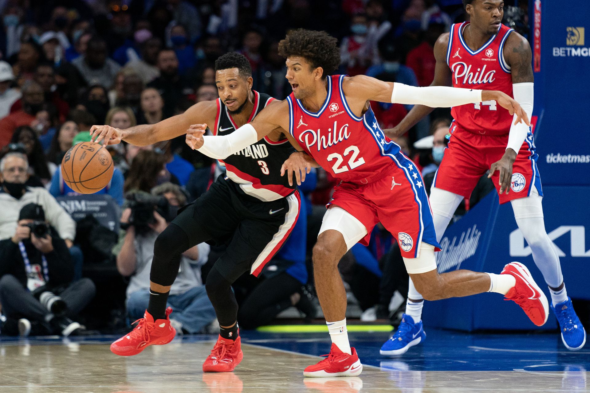 Philadelphia 76ers guard Matisse Thybulle (22) knocks the ball from Portland Trail Blazers guard CJ McCollum (3) during the fourth quarter at Wells Fargo Center in Philadelphia, Pennsylvania on Nov. 1, 2021.