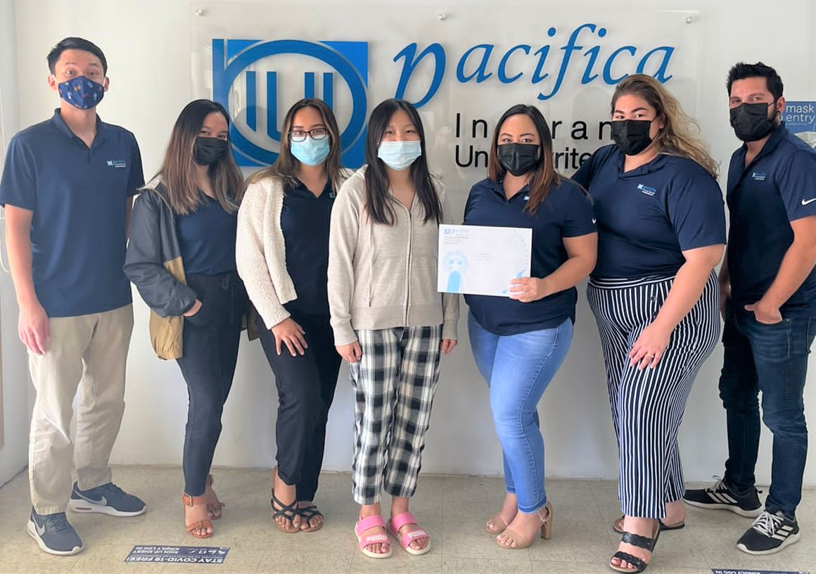 ChiaHui Wang, a student from Saipan International School receiving her $200 prize and certificate from Team Pacifica Insurance Underwriters Inc.