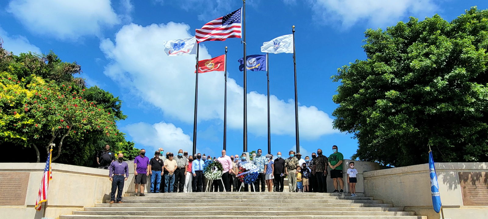 CNMI officials, veterans,  military personnel, family members and other residents pose for a photo at the Court of Honor.