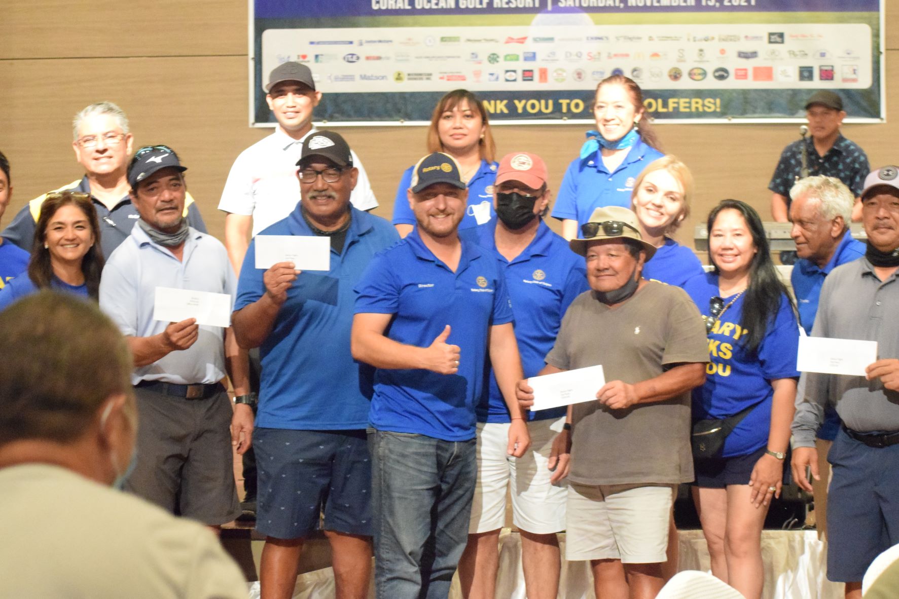 Nick Sablan, third right, holds his Senior Flight award as he poses for a photo with third placer Ben Duenas, right, fourth placer Joe Tudela, second left, Tony Satur, third left, on behalf of Joe Kamikaze Camacho, and officials of Rotary Club of Saipan during the awards banquet for the Goodwill Golf Classic at Saipan World Resort on Saturday.