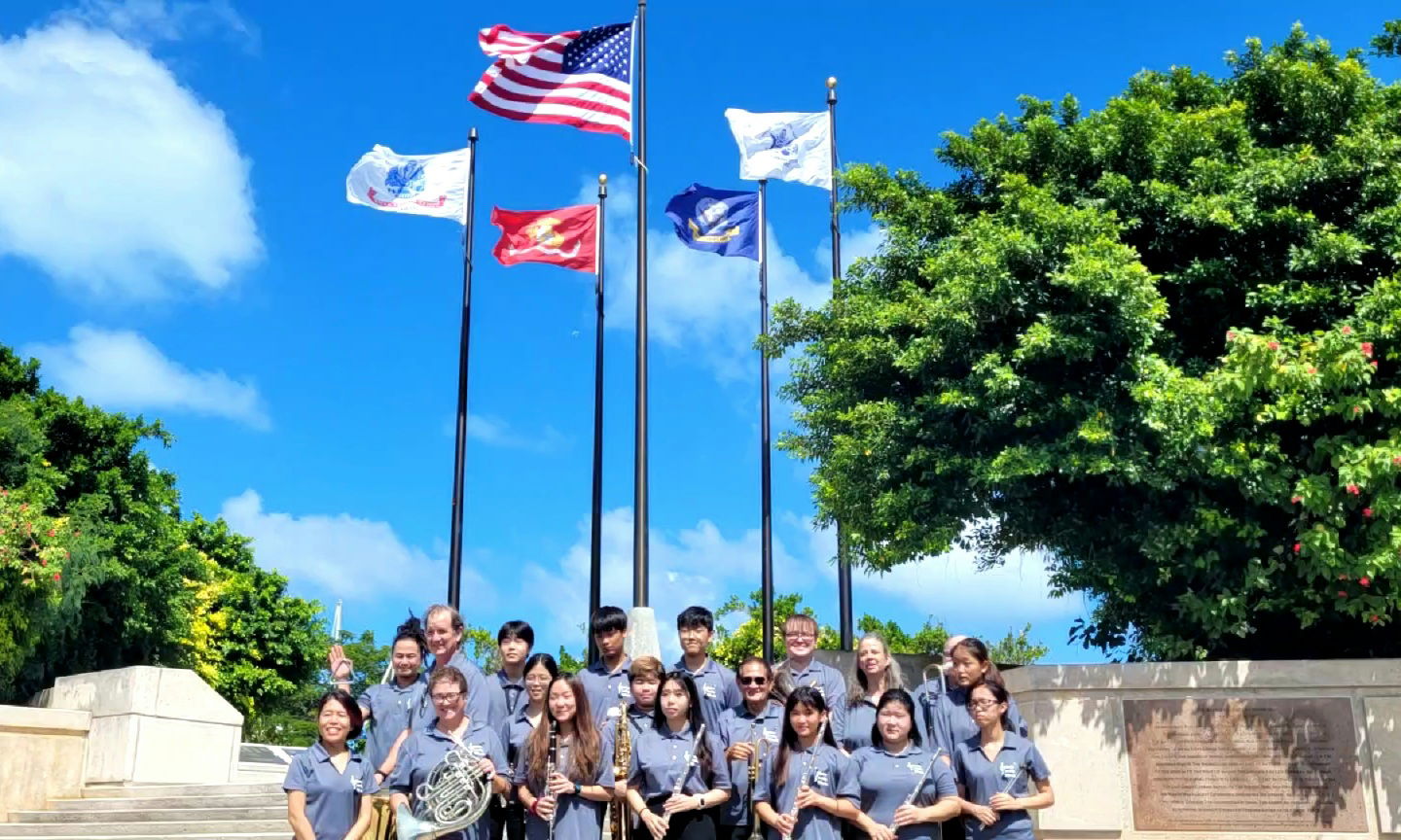 The Saipan Pacific Winds Concert Band members pose for a photo on the Court of Honor steps following the conclusion of the ceremony.