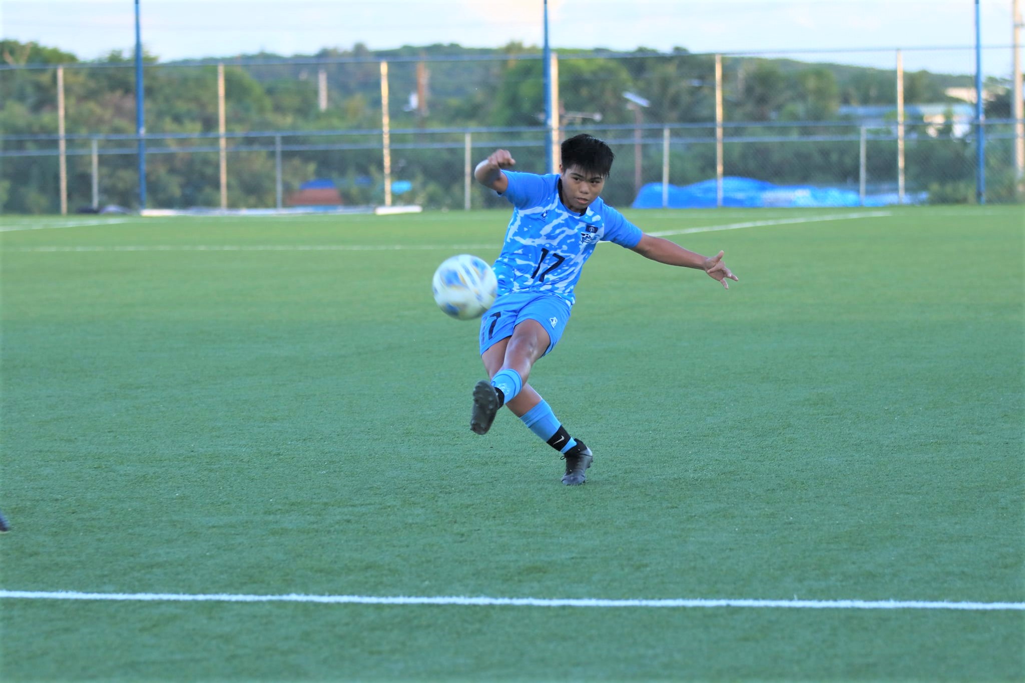 NMI U18's Jerald Aquino attempts a shot during a Marianas Soccer League game at the NMI Soccer Training Center.