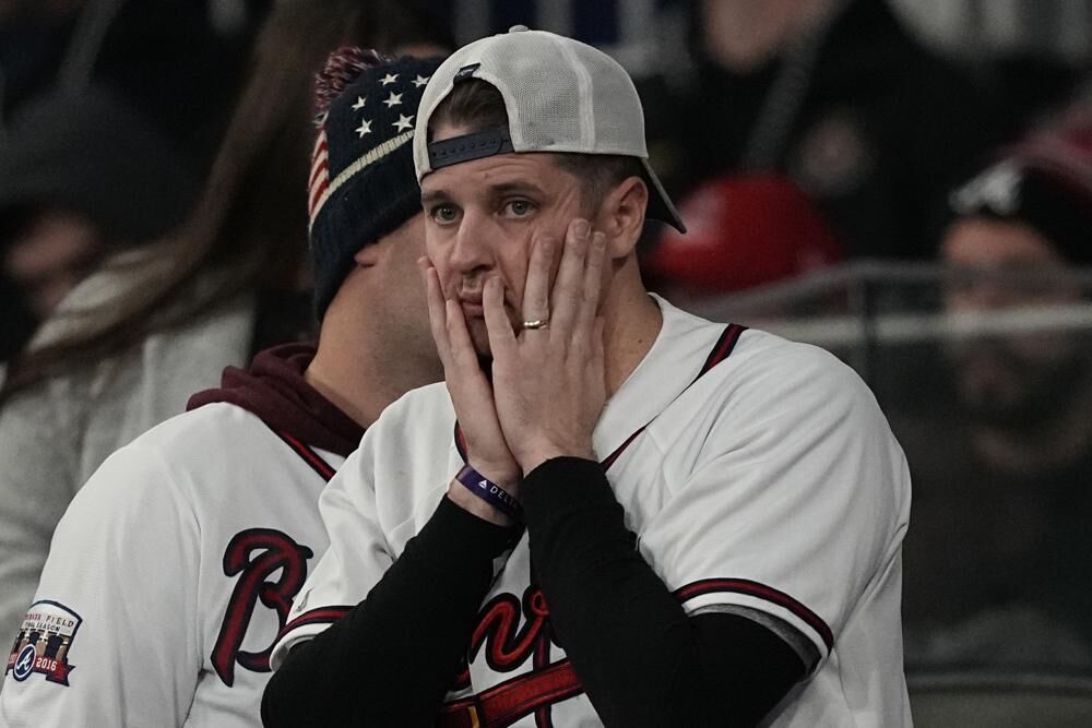 An Atlanta Braves fan watches during the ninth inning in Game 5 of baseball's World Series between the Houston Astros and the Atlanta Braves in Atlanta.