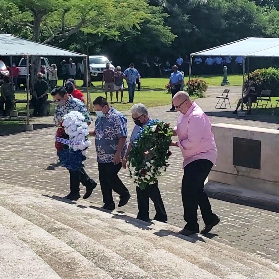 Gov. Ralph DLG Torres and Lt. Gov. Arnold I. Palacios, center, lead the wreath-laying ceremony.