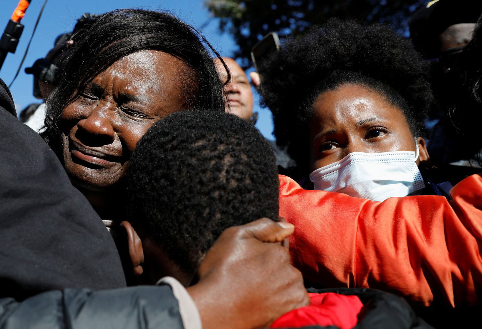 People react outside the Glynn County Courthouse after the jury reached a guilty verdict in the trial of William "Roddie" Bryan, Travis McMichael and Gregory McMichael, charged with the February 2020 death of 25-year-old Ahmaud Arbery, in Brunswick, Georgia, Nov. 24, 2021.