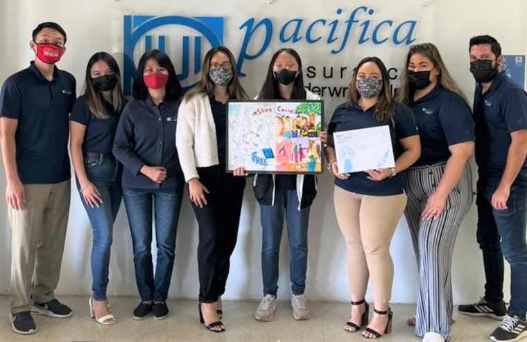 Byul An, 7th grade student from Saipan Community School receiving her $200 prize and certificate from Team Pacifica Insurance Underwriters Inc.