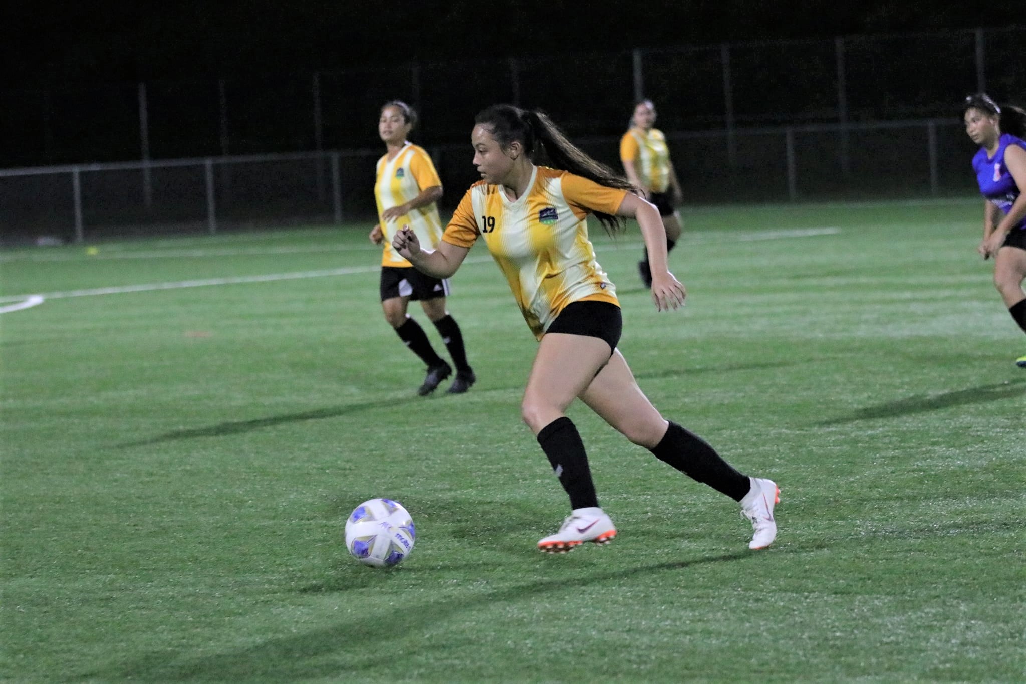 Kanoa’s Pauline Joyce goes on the offensive during a  Premier Division game of the Dove Women's League tournament at the NMI Soccer Training Center.