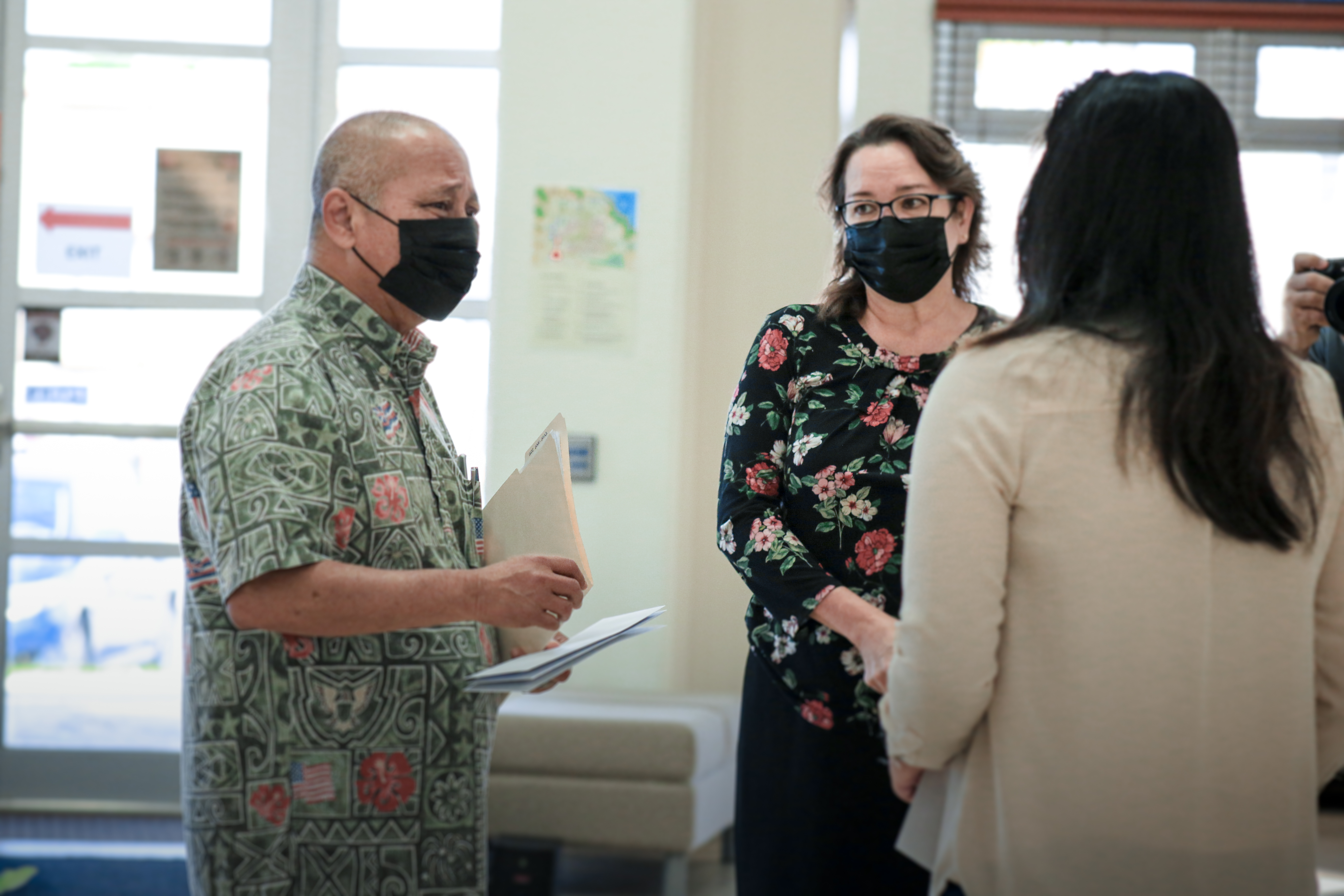 Carlos Camacho, left, manager of the Felix M. and Governor Carlos Camacho Scholarship Foundation, and Guam Community College President Mary Okada, right.