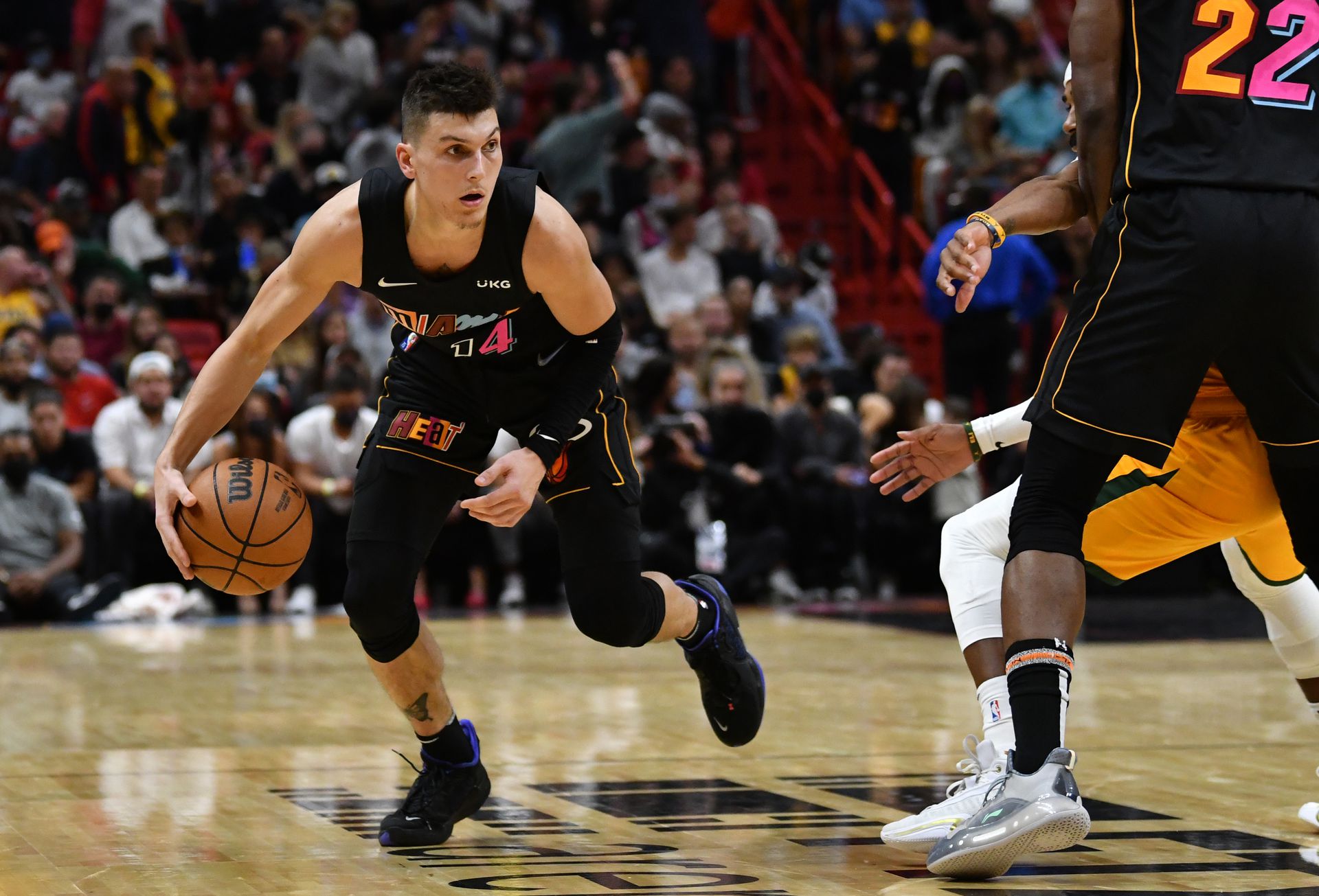 Miami Heat guard Tyler Herro (14) brings the ball up the court against the Utah Jazz during the second half at FTX Arena in Miami, Florida on Nov. 6, 2021.