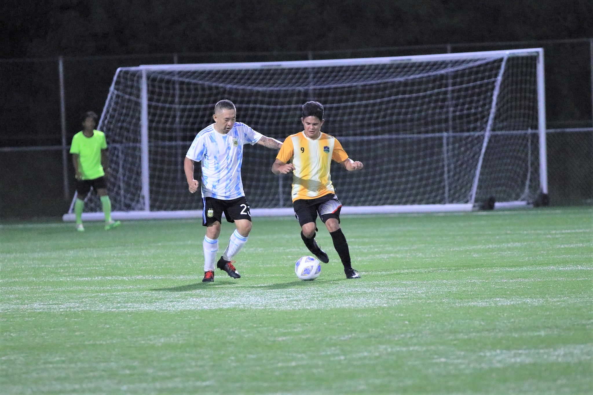 Saipan United's Kenneth Guo plays defense against Kanoa's Russell Zapanta in a Hafa Adai Cup game last week.