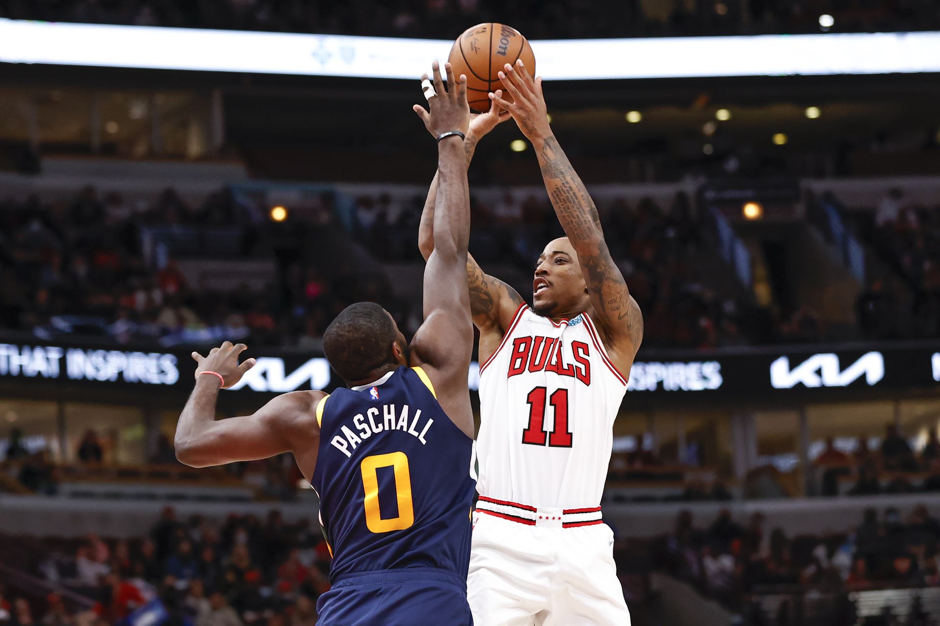 Chicago Bulls forward DeMar DeRozan (11) shoots against Utah Jazz forward Eric Paschall (0) during the second half at United Center in Chicago, Illinois on  Oct. 30, 2021.