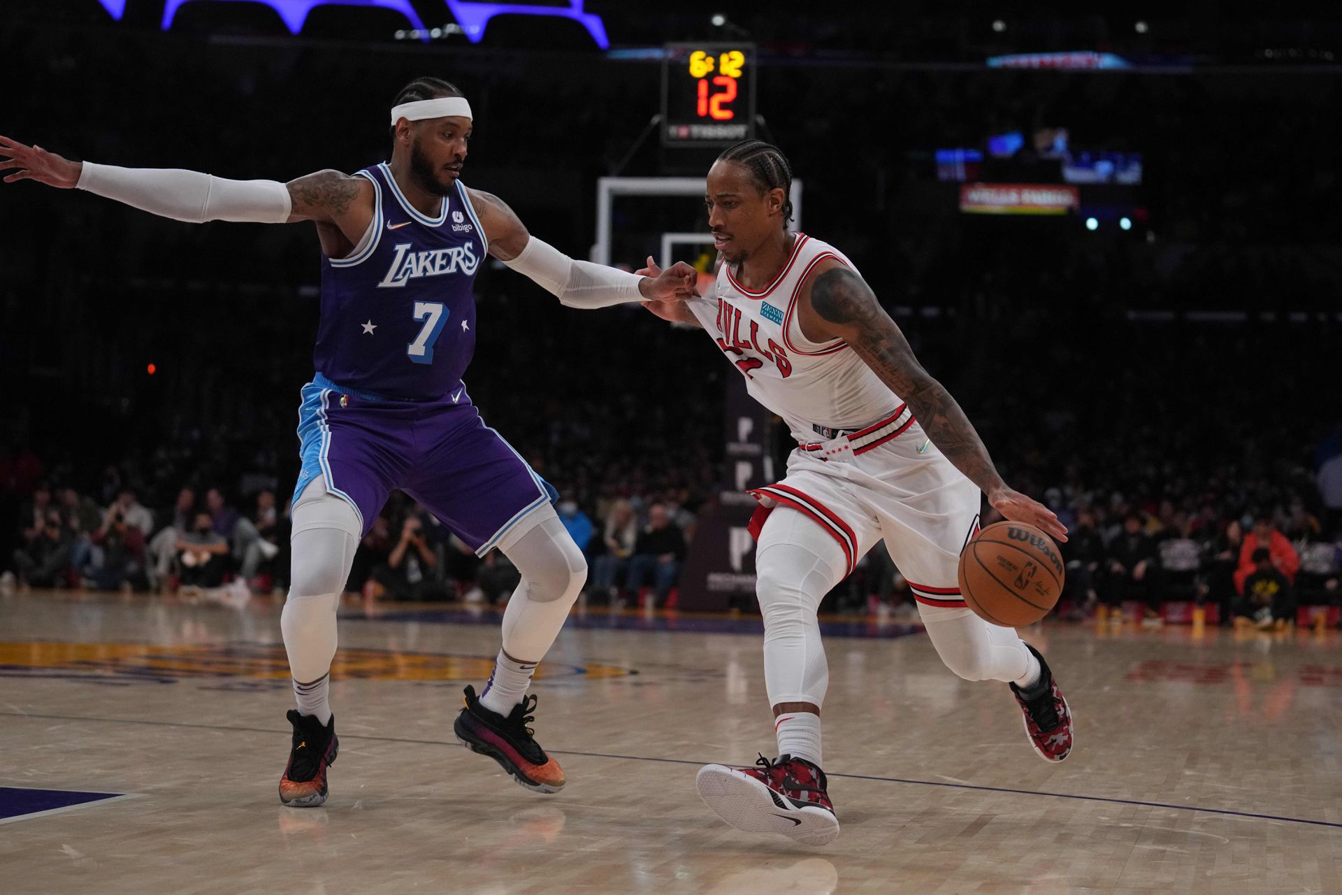 Chicago Bulls forward DeMar DeRozan (11) is defended by Los Angeles Lakers forward Carmelo Anthony (7) in the second half at Staples Center in Los Angeles, California on  Nov. 15, 2021. The Bulls defeated the Lakers 121-103.