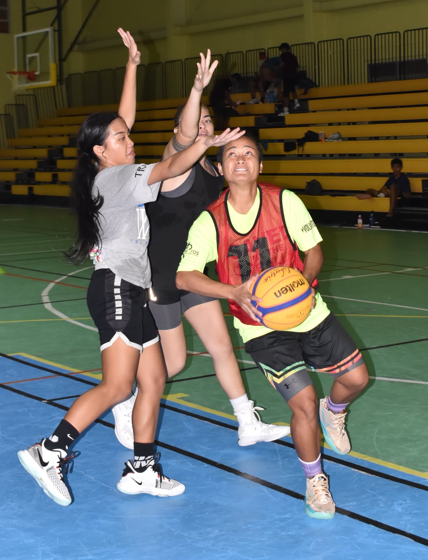 Irish Pagarao, seen here driving against two players during last month’s 3x3 tournament at the Gilbert C. Ada Gymnasium, has been selected to coach the NMI Women’s National Team.