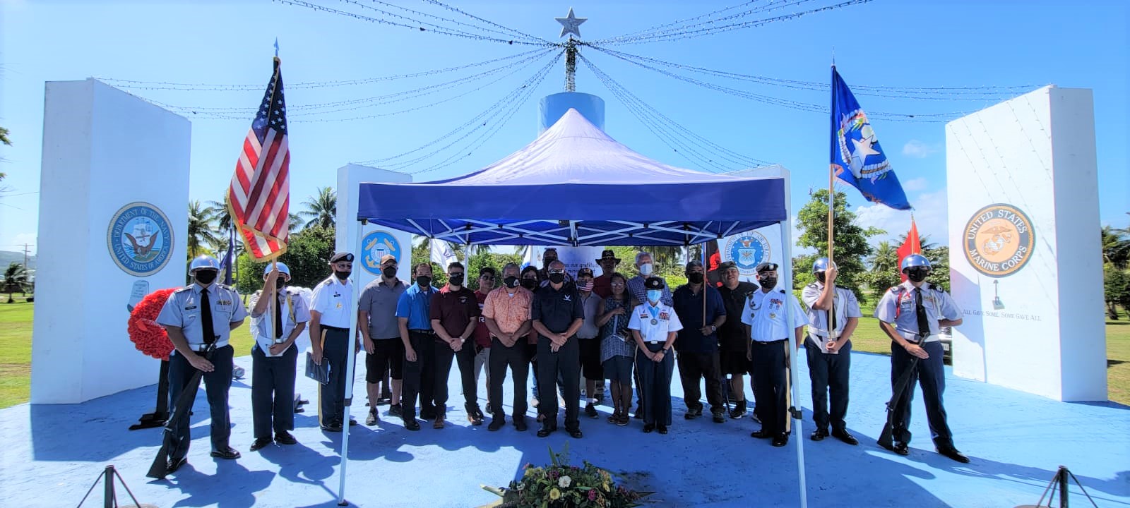 Tinian officials with veterans and JROTC cadets pose for a photo after the conclusion of the  ceremony.