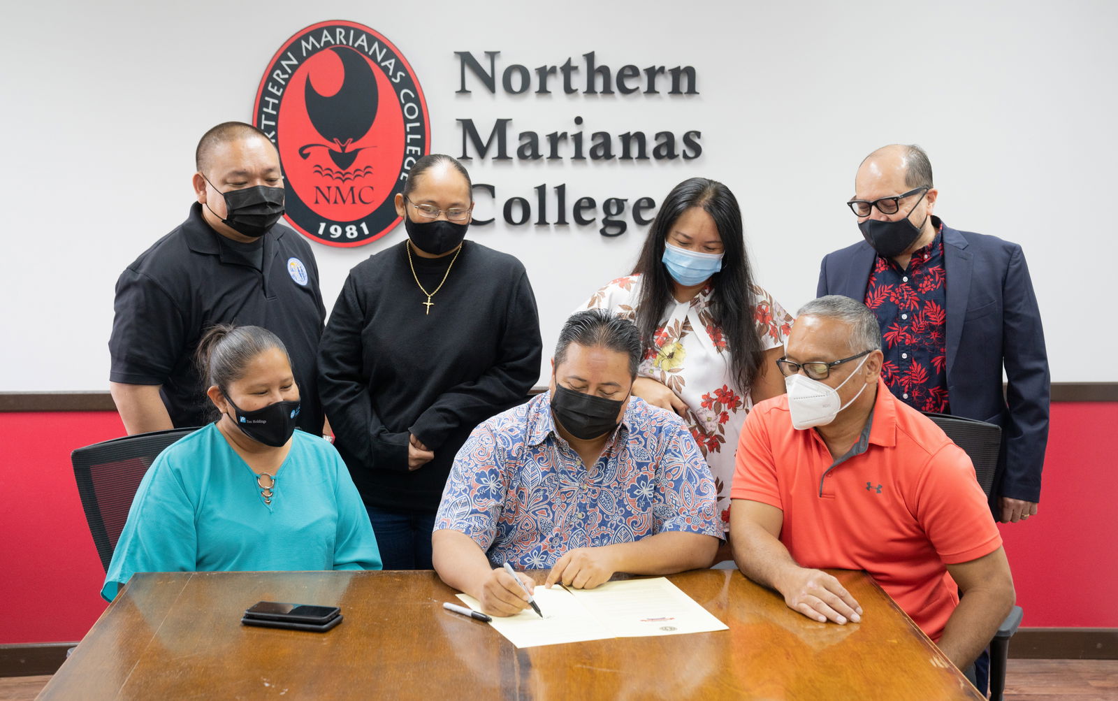 Gov. Ralph DLG Torres signs a proclamation Monday designating Nov. 15-19 as National Apprenticeship Week in the CNMI. Looking on are Northern Marianas College President Dr. Galvin Deleon Guerrero, NMC Board Chairman Charles Cepeda, NMC Regent Irene Torres, acting Education Commissioner Eric Magofna, Northern Marianas Technical Institute Interim CEO Jodina Attao and NMTI board member Catherine Attao-Toves. Not in photo: CNMI Department of Labor Secretary Vicky I. Benavente who attended the ceremony virtually. NMC, along with its partners is working to build a registered apprenticeship program, one that will diversify and build the talent of the islands’ local workforce.