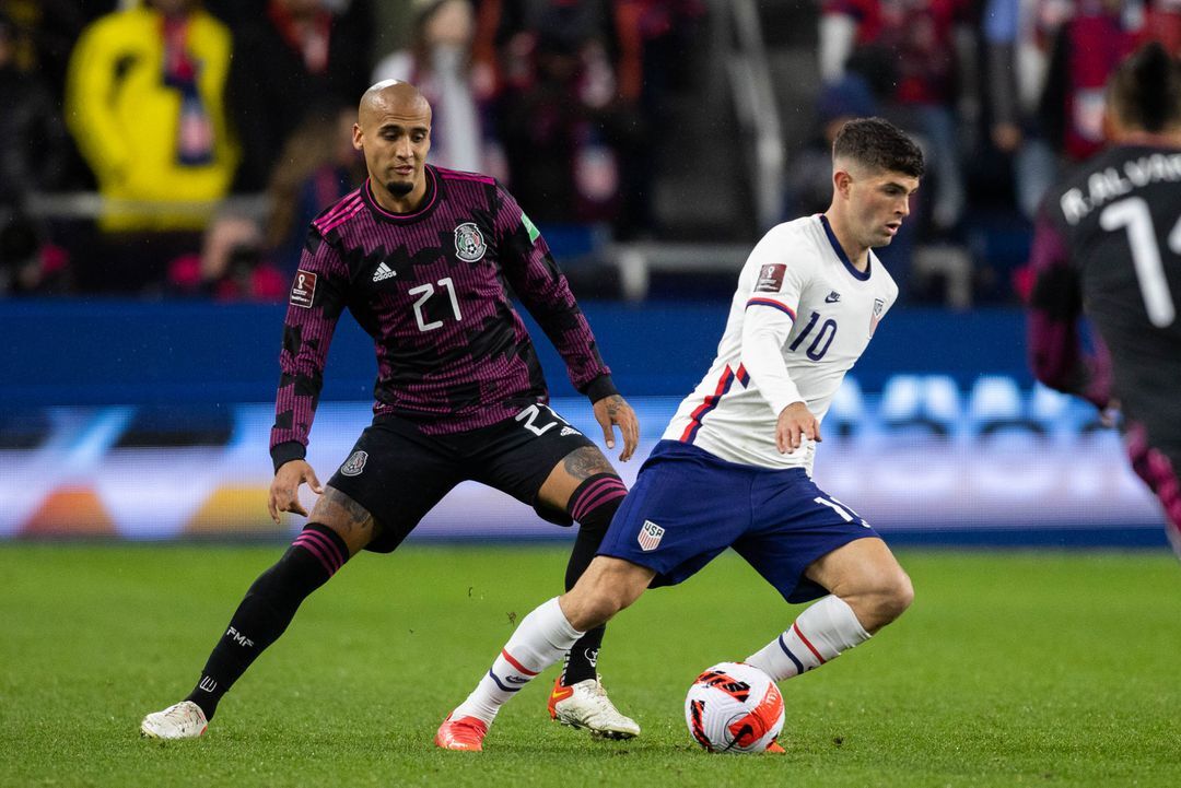 United States forward Christian Pulisic (10) dribbles the ball while Mexico defender Luis Rodriguez (21) defends during a FIFA World Cup Qualifier soccer match at TQL Stadium in Cincinnati, Ohio on Nov. 12, 2021.