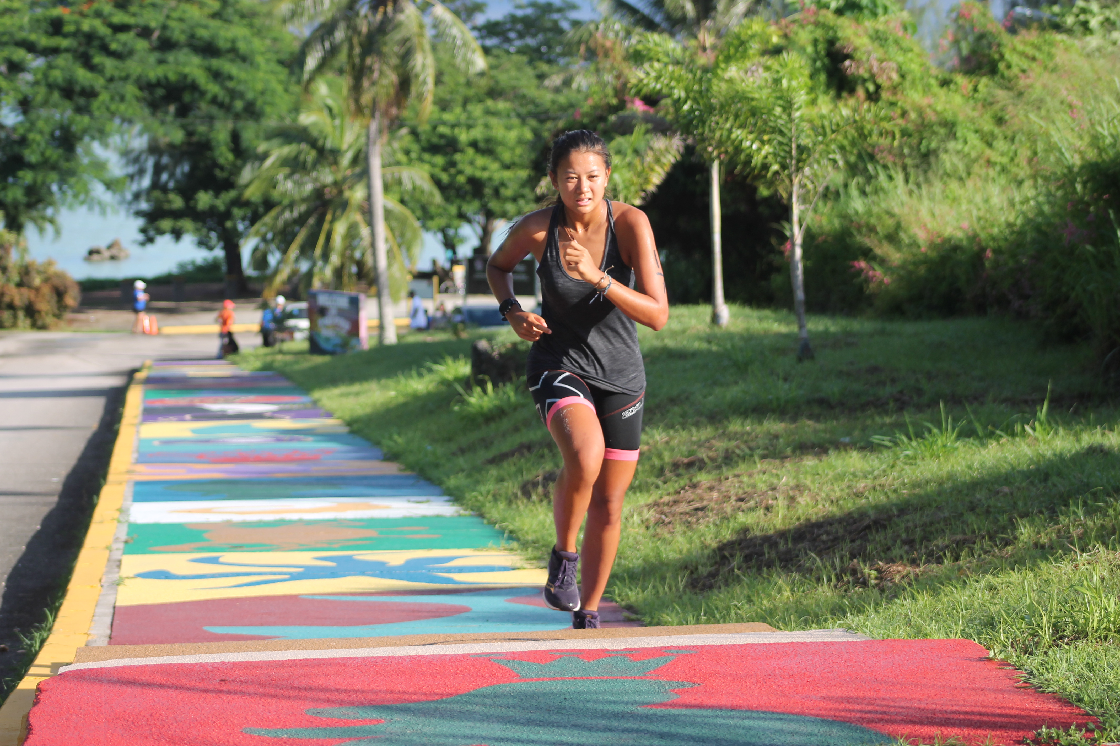 Tania Tan runs up the steps at Paupau Beach during a previous race.