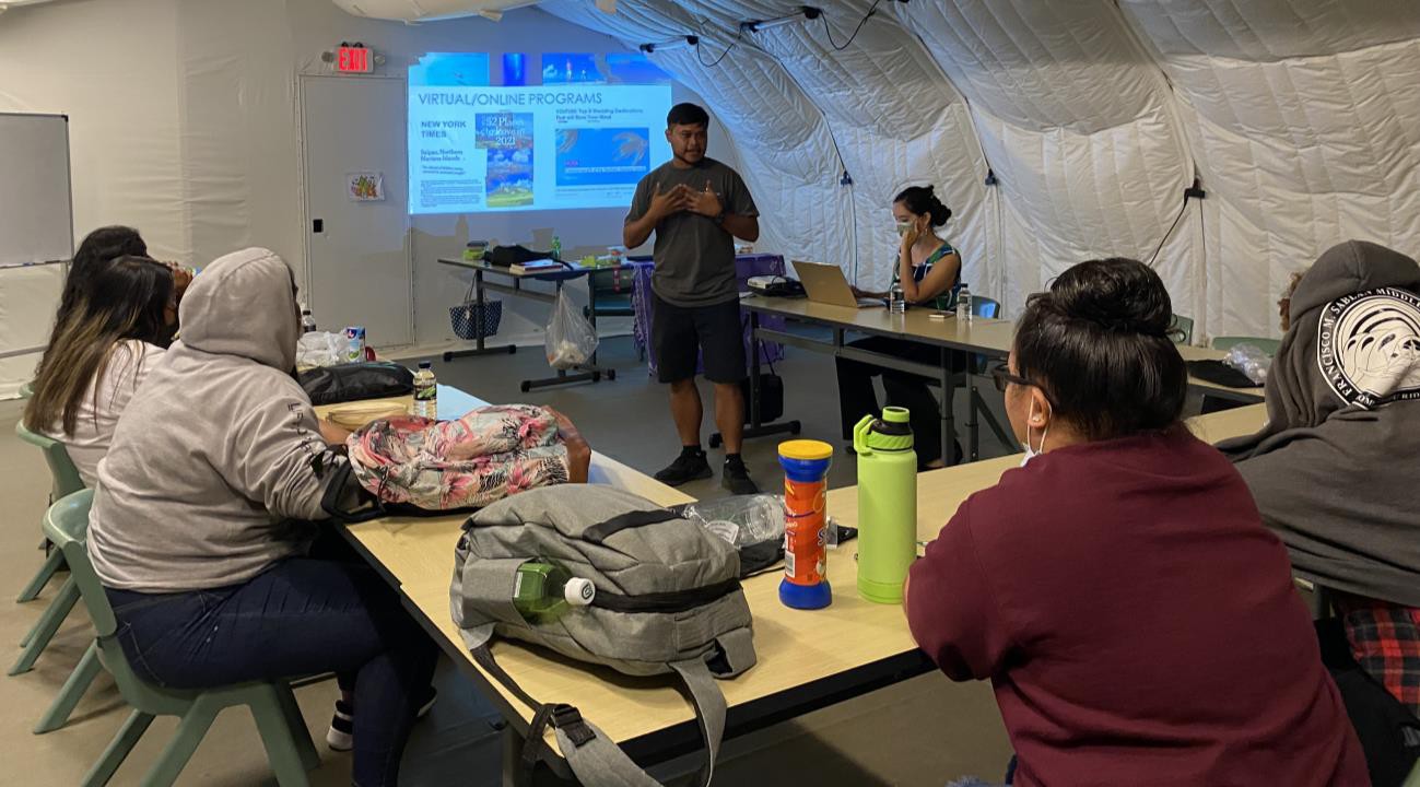 Marianas Visitors Authority community projects coordinator Jack Aranda shares about the work of the tourism office with students Da’ok Academy in Koblerville on Oct. 28, 2021.