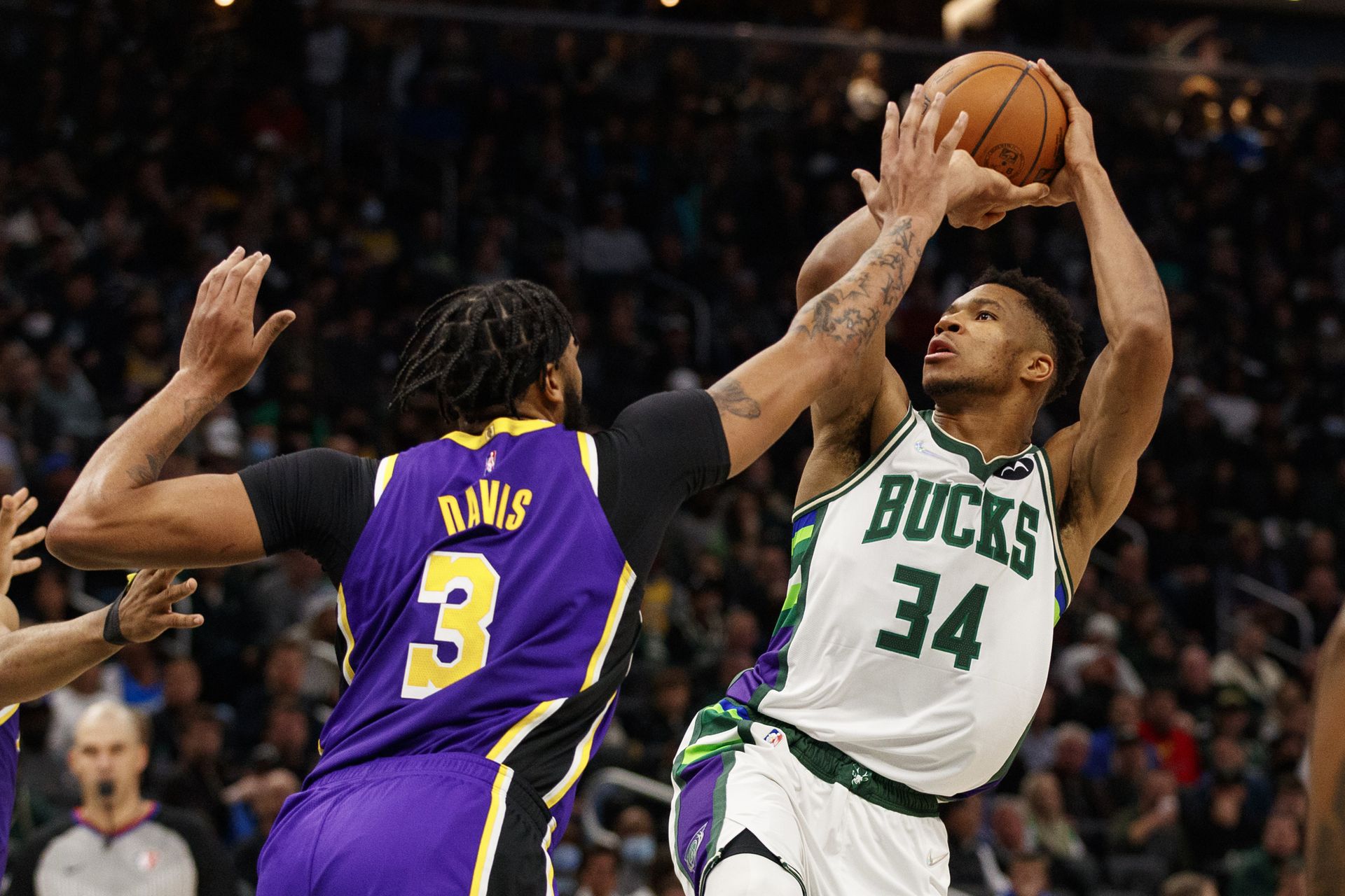 Milwaukee, Wisconsin, USA; Milwaukee Bucks forward Giannis Antetokounmpo (34) shoots against Los Angeles Lakers forward Anthony Davis (3) during the third quarter at Fiserv Forum on Nov. 17, 2021.