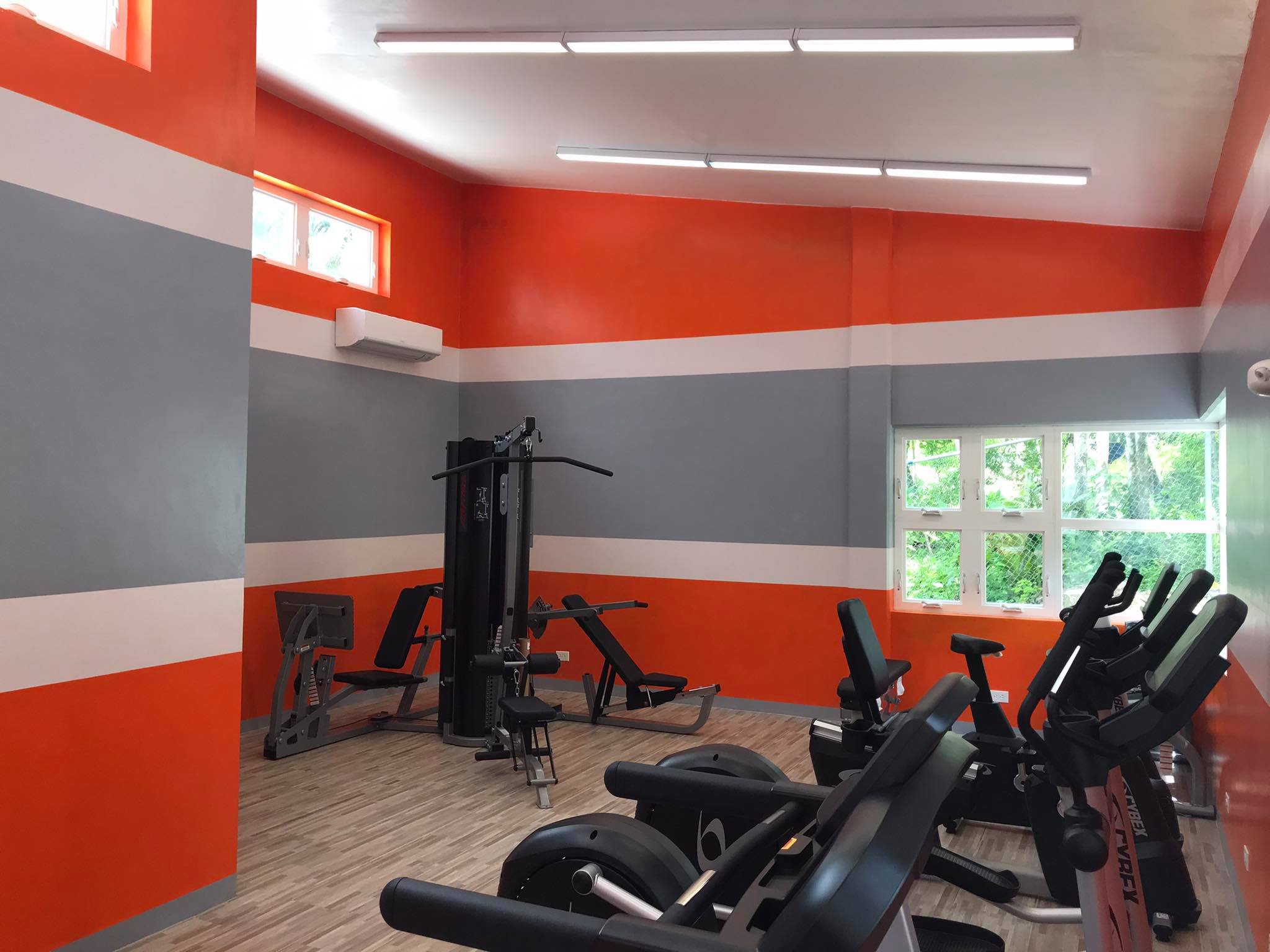 Gym room with exercise equipment.