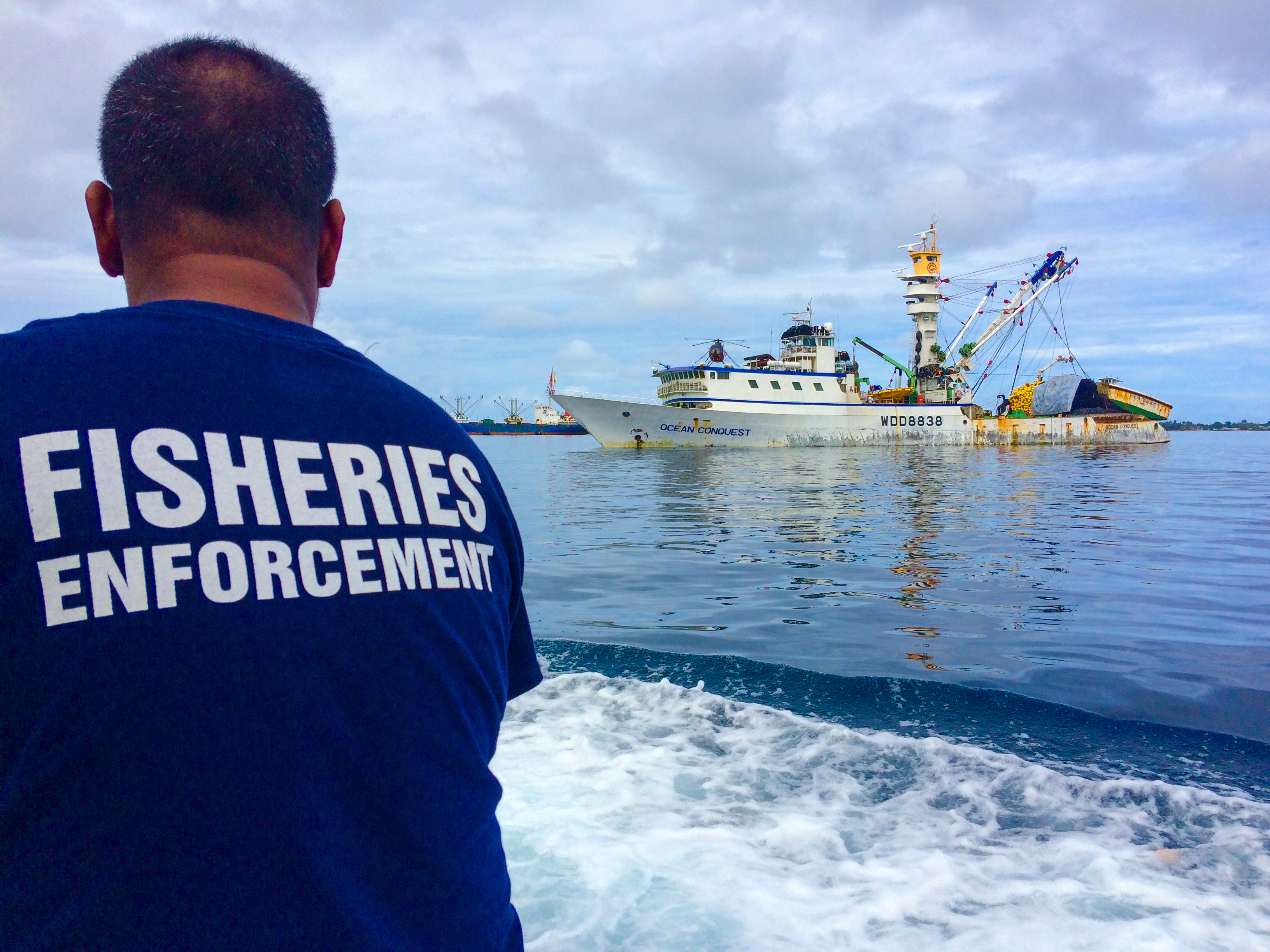 A fisheries officer in Majuro heads out to inspect purse seine fishing vessels anchored in Majuro's lagoon.