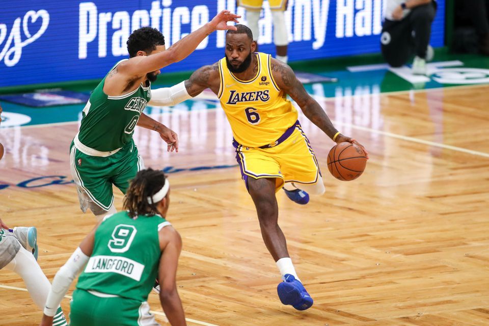Los Angeles Lakers forward LeBron James (6) drives to the basket defended by Boston Celtics forward Jayson Tatum (0) during the second half at TD Garden Boston, Massachusetts on Nov. 19, 2021.