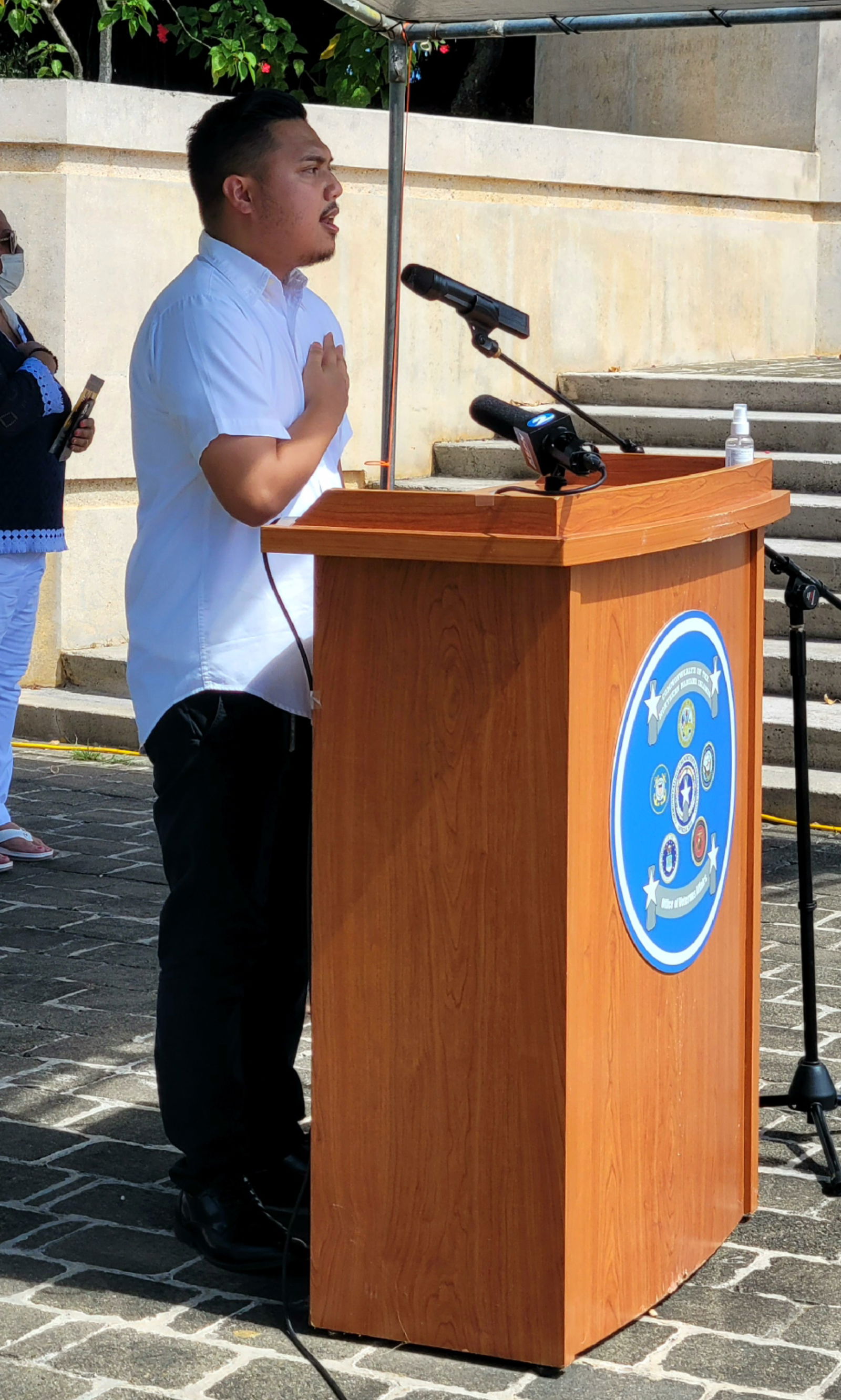Roman Tudela Jr. sings the national anthem.