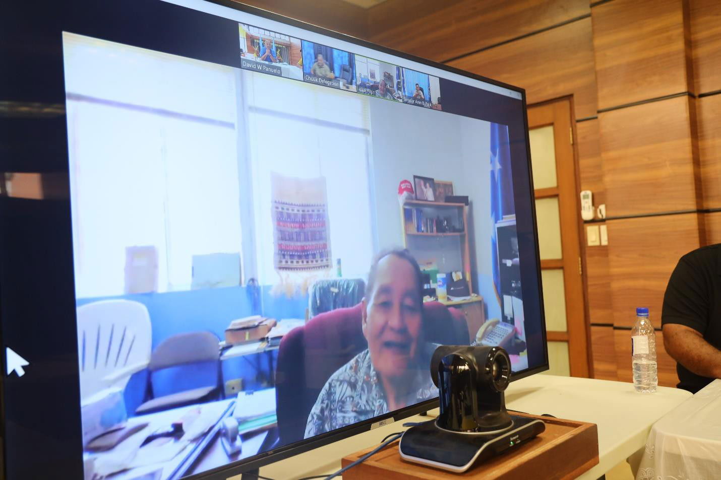 FSM Sen. Isaac Figir, seen on screen, asks about the status of the Low-Income Household Assistance program.