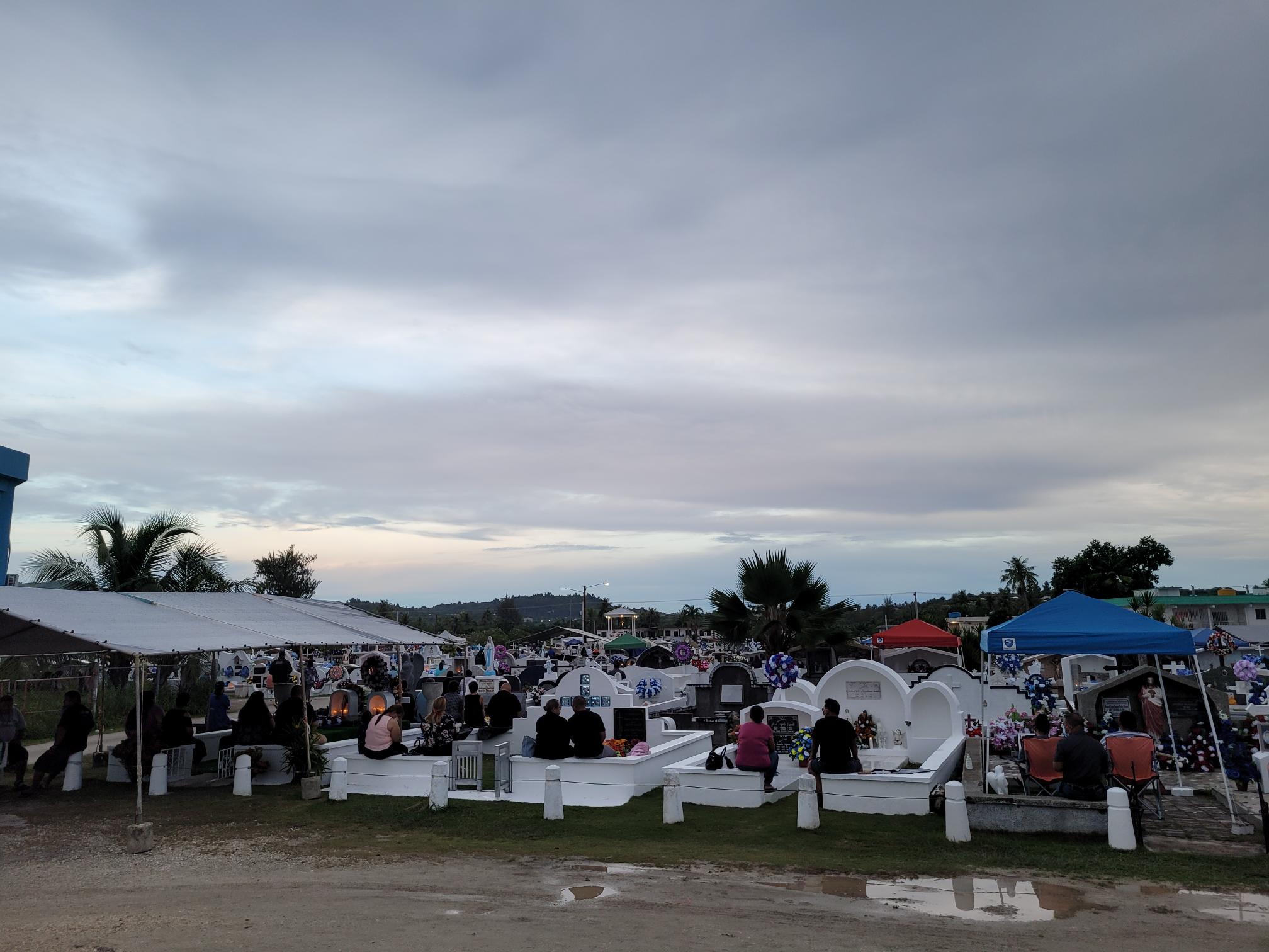 Saipan residents visit the gravesites of their loved ones at the Chalan Kanoa cemetery on Monday, All Saints Day.