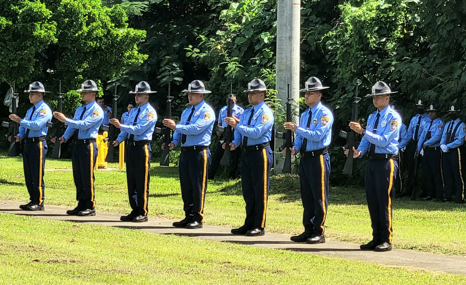 Department of Public Safety officers are ready to fire the gun salute.