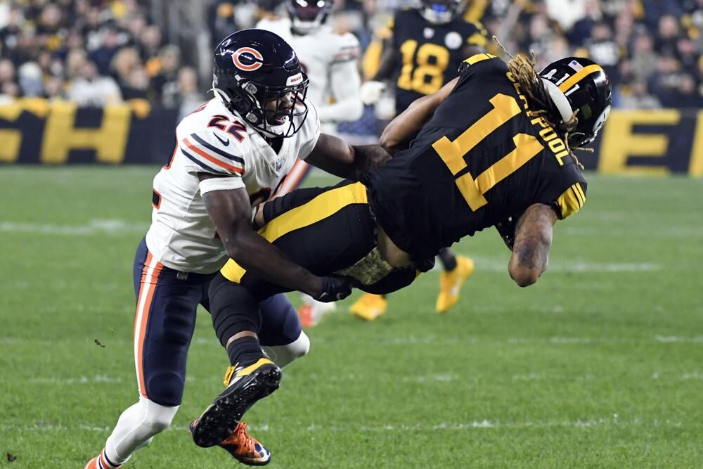 Pittsburgh Steelers wide receiver Chase Claypool (11) is tackled by Chicago Bears cornerback Kindle Vildor (22) after making a catch during the first half an NFL football game, Monday, in Pittsburgh. 