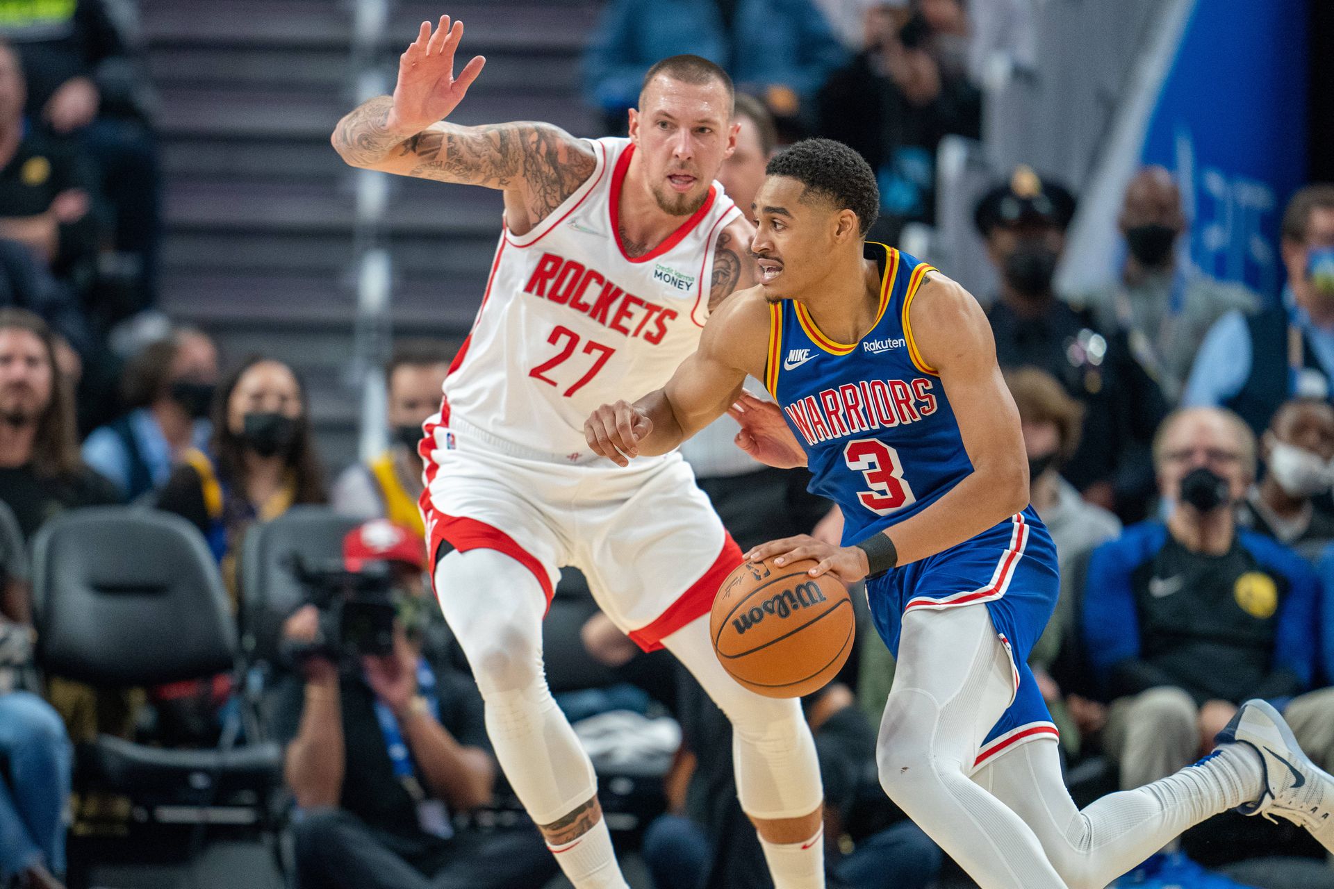 Golden State Warriors guard Jordan Poole (3) drives to the net against Houston Rockets center Daniel Theis (27) during the second quarter at Chase Center in San Francisco, California on Nov. 7, 2021.