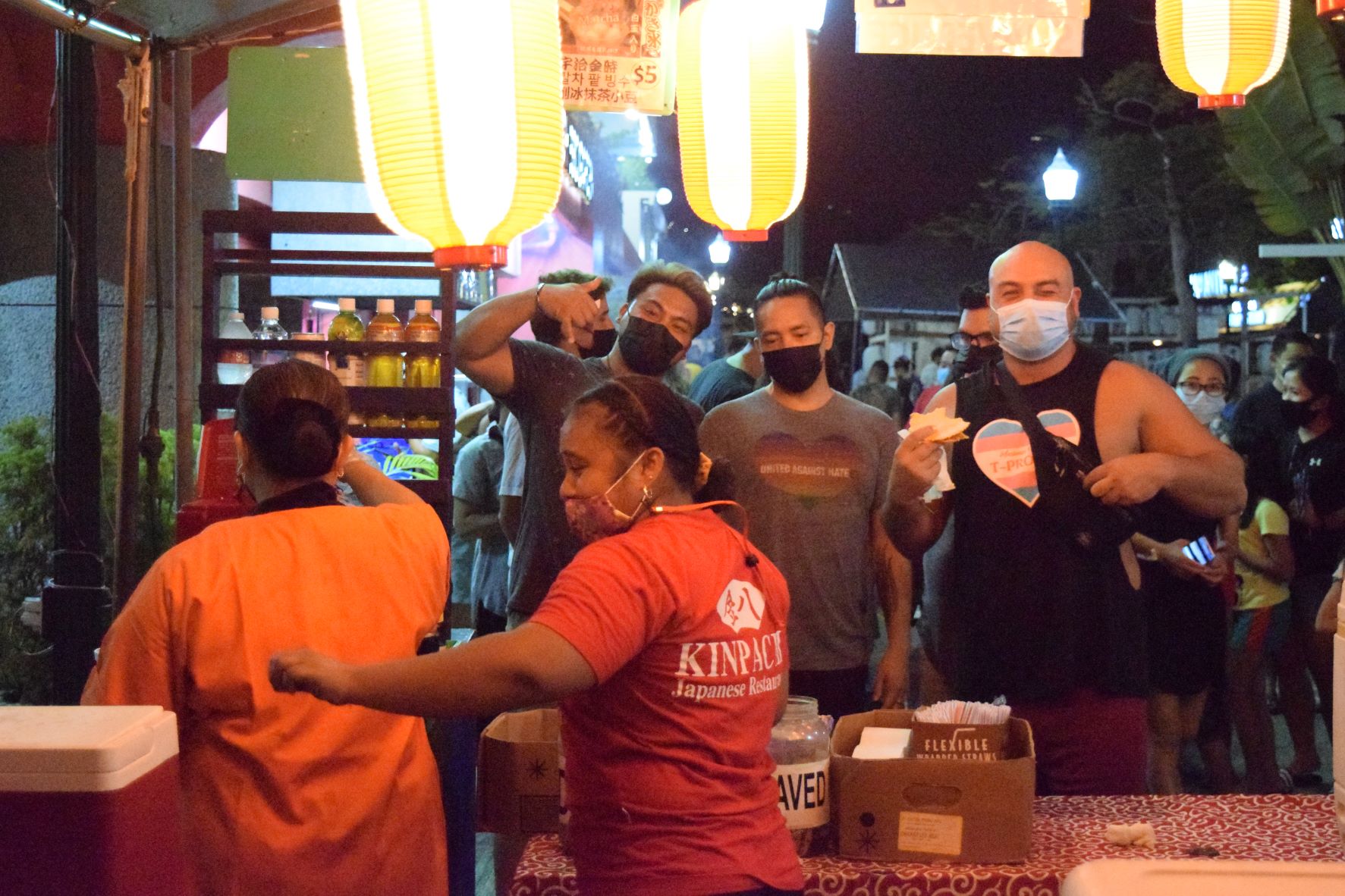 People line up for Japanese food during the Japanese Autumn Festival at Paseo De Marianas in Garapan on Saturday.