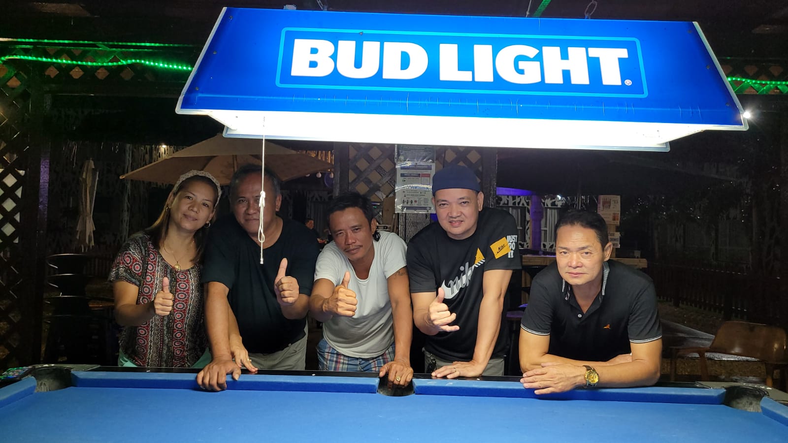 Bamboo Club's Randy David, center, and team-mates Jess Guiri, Roman Rodriguez and Rey Hermogenes pose for a photo after vanquishing Marpac's Eagle's Eye on Thursday at Bamboo Bar.