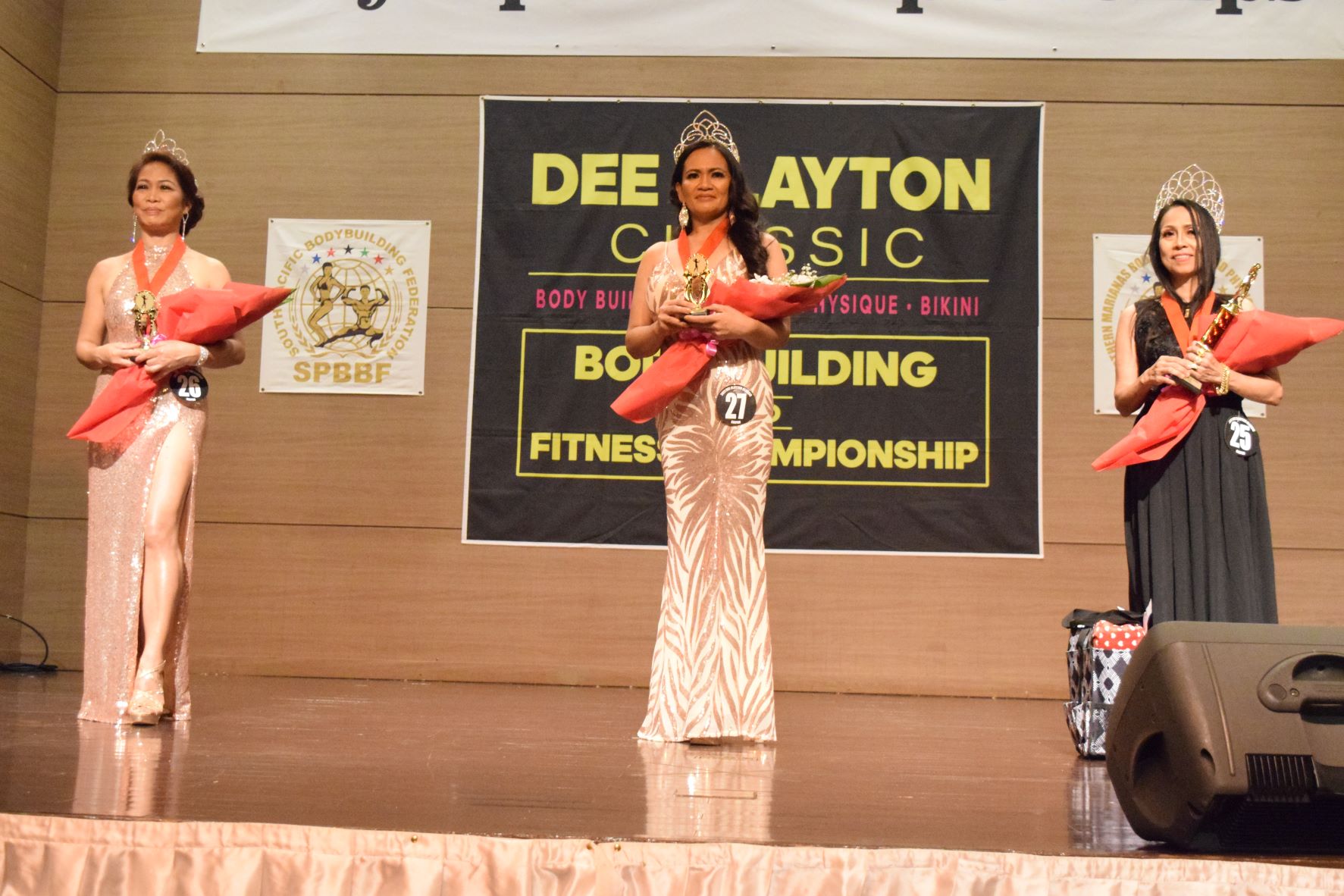 Fitness pageant winner Amy Alano, right, with second placer Annie Tampus, center, and Connie Quidato who finished third.