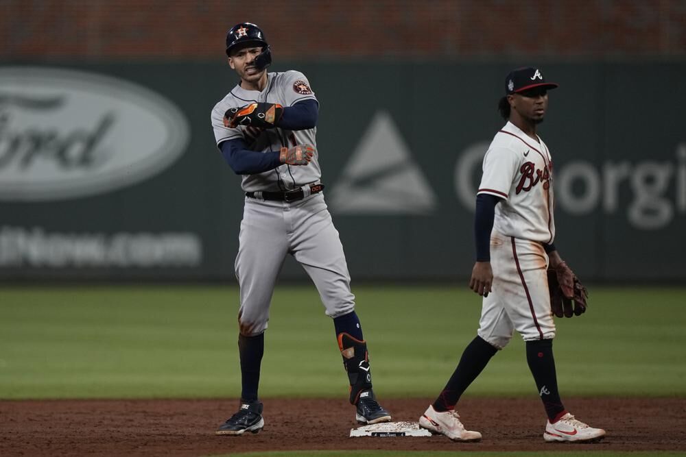 Houston Astros' Carlos Correa celebrates after an RBI-double during the third inning in Game 5 of baseball's World Series between the Houston Astros and the Atlanta Braves Sunday in Atlanta. 