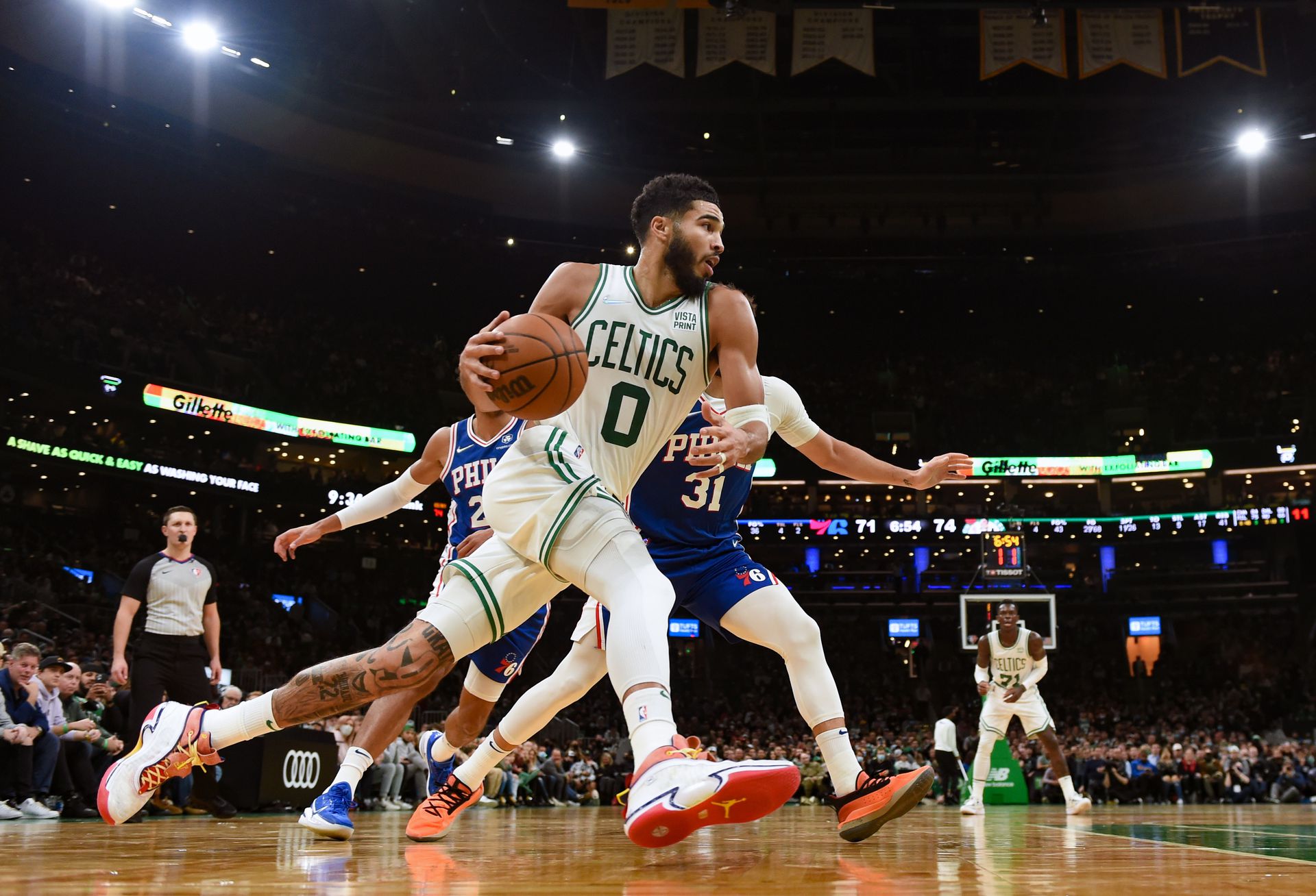 Boston Celtics forward Jayson Tatum (0) drives to the basket while Philadelphia 76ers guard Seth Curry (31) defends during the second half at TD Garden in Boston, Massachusetts on Dec. 1, 2021.