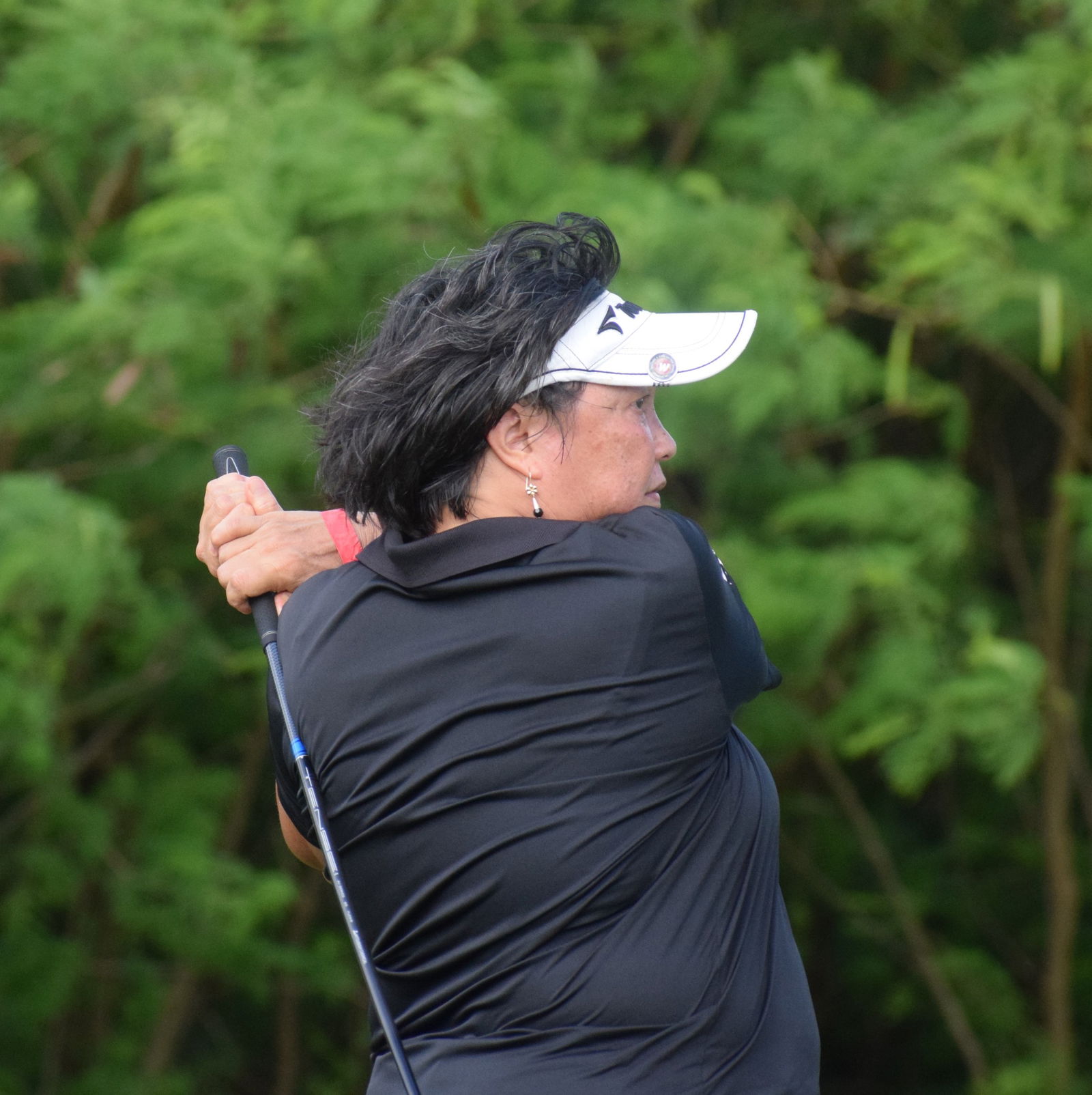 Lorraine Babauta swings for Hole No. 12.