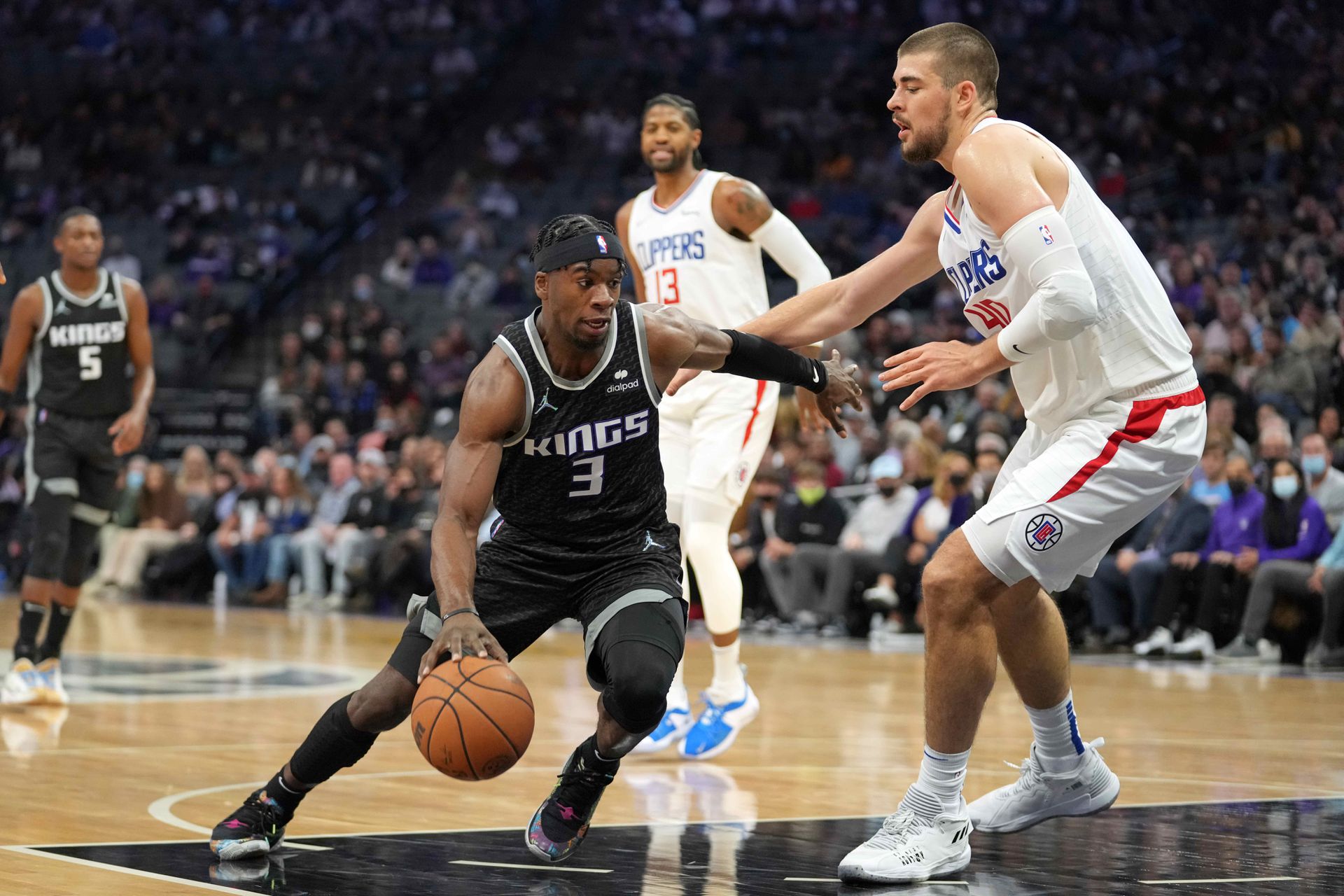 Sacramento Kings guard Terence Davis (3) drives against LA Clippers center Ivica Zubac (40) during the second quarter at Golden 1 Center in Sacramento, California on Dec. 4, 2021.