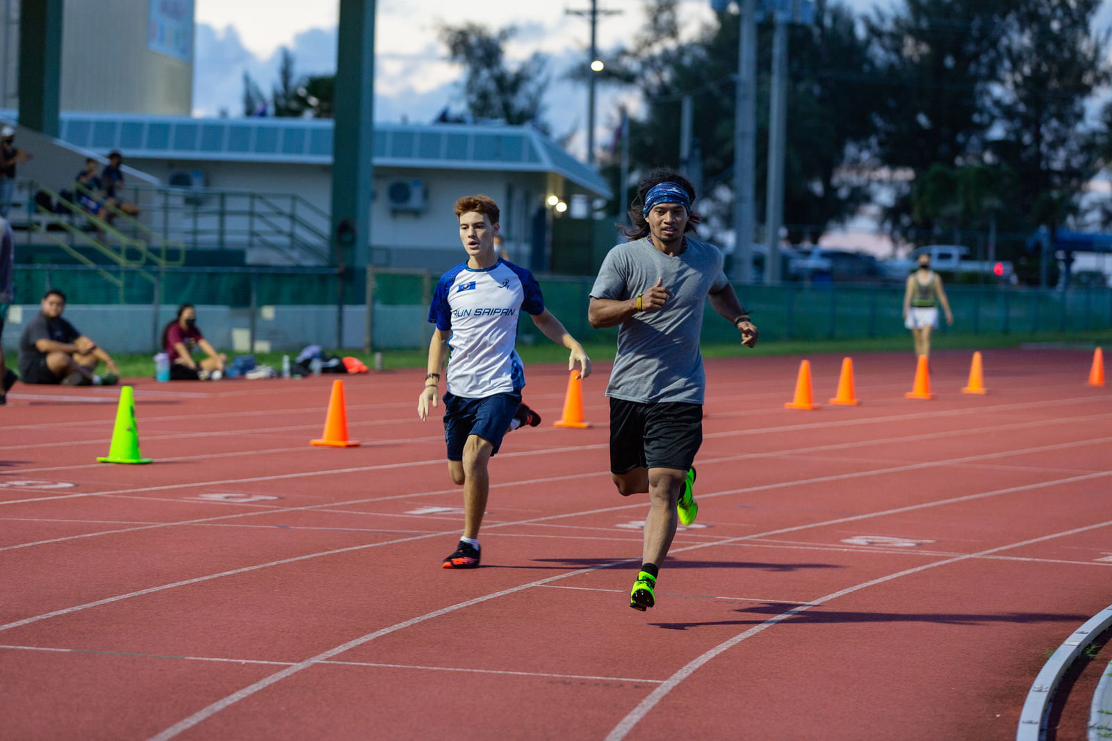 Orrin Pharmin and Theo Rodgers head to the finish line of the 400m event of the Oceania Athletics Association Virtual Championships at the Oleai Sports Complex on Dec. 22.