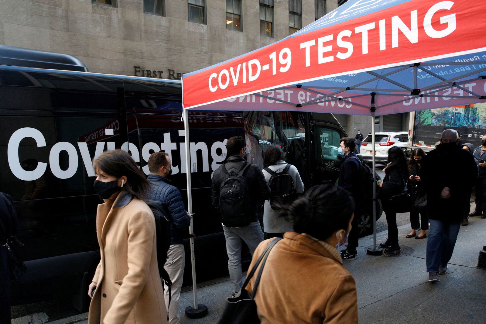 People wait in line to take coronavirus disease tests at pop-up testing site in New York City, Dec. 14, 2021.