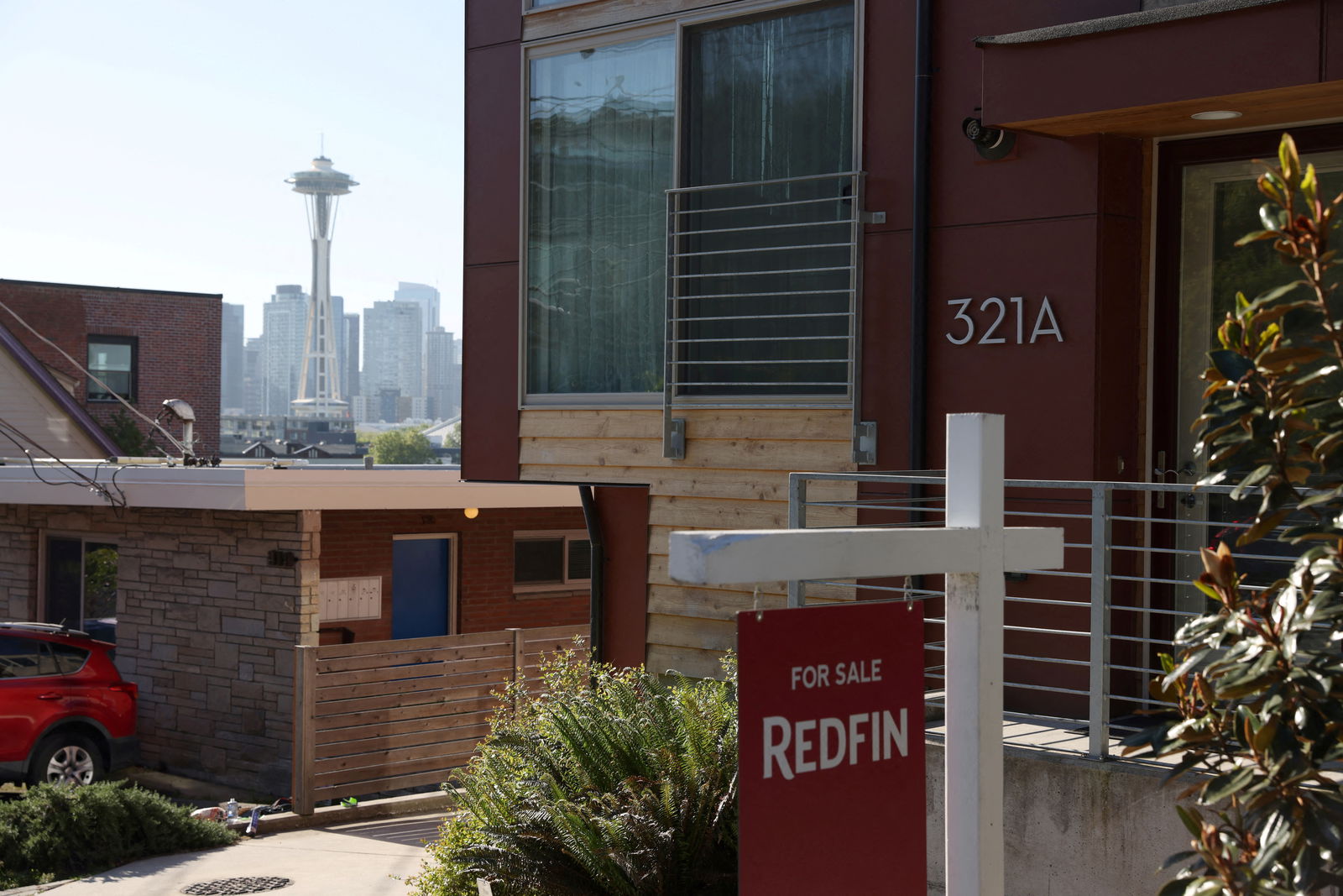 A "For Sale" sign is posted outside a residential home in the Queen Anne neighborhood near the Space Needle in Seattle, Washington, May 14, 2021.