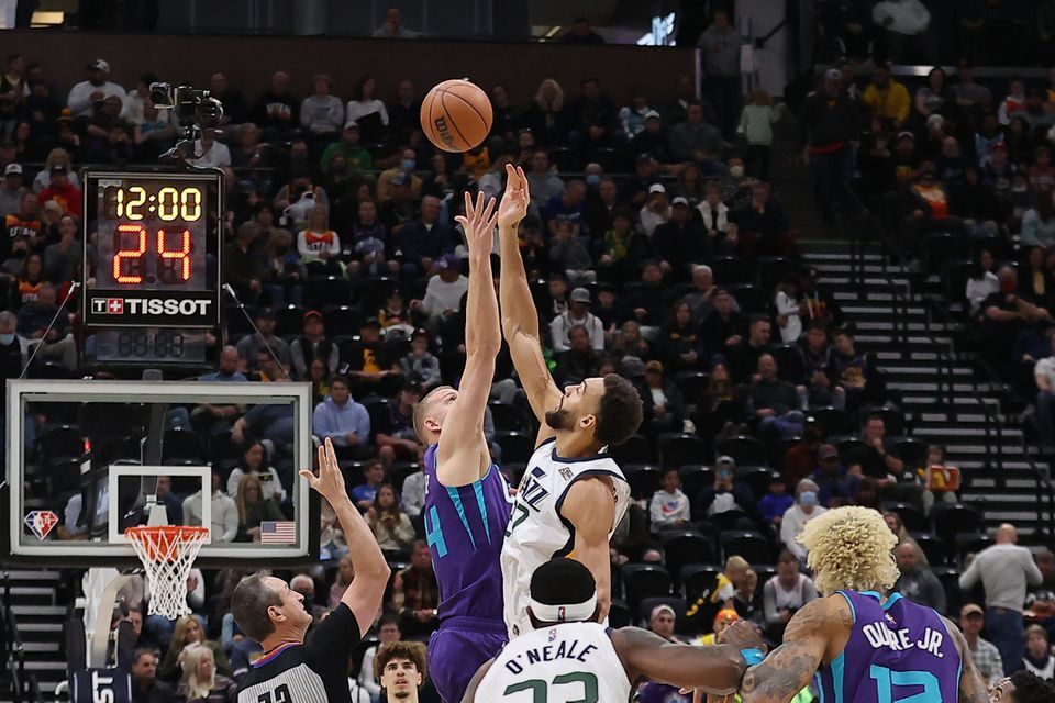 Charlotte Hornets center Mason Plumlee (24) and Utah Jazz center Rudy Gobert (27) jump for the ball to start the game at Vivint Arena in Salt Lake City, Utah on Dec. 20, 2021.