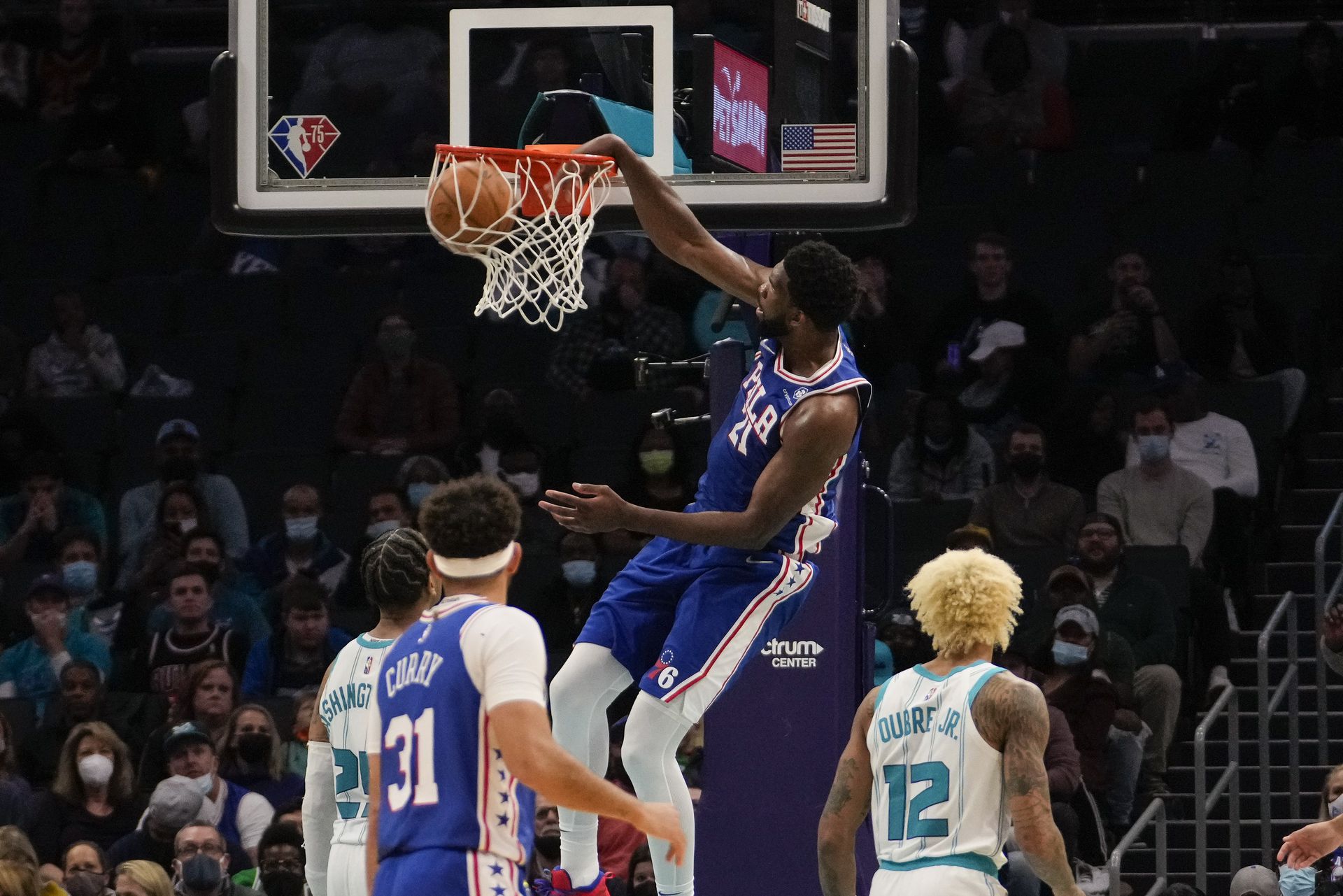 Philadelphia 76ers center Joel Embiid (21) goes up for a dunk against the Charlotte Hornets during the second half at the Spectrum Center in Charlotte, North Carolina on Dec. 6, 2021.