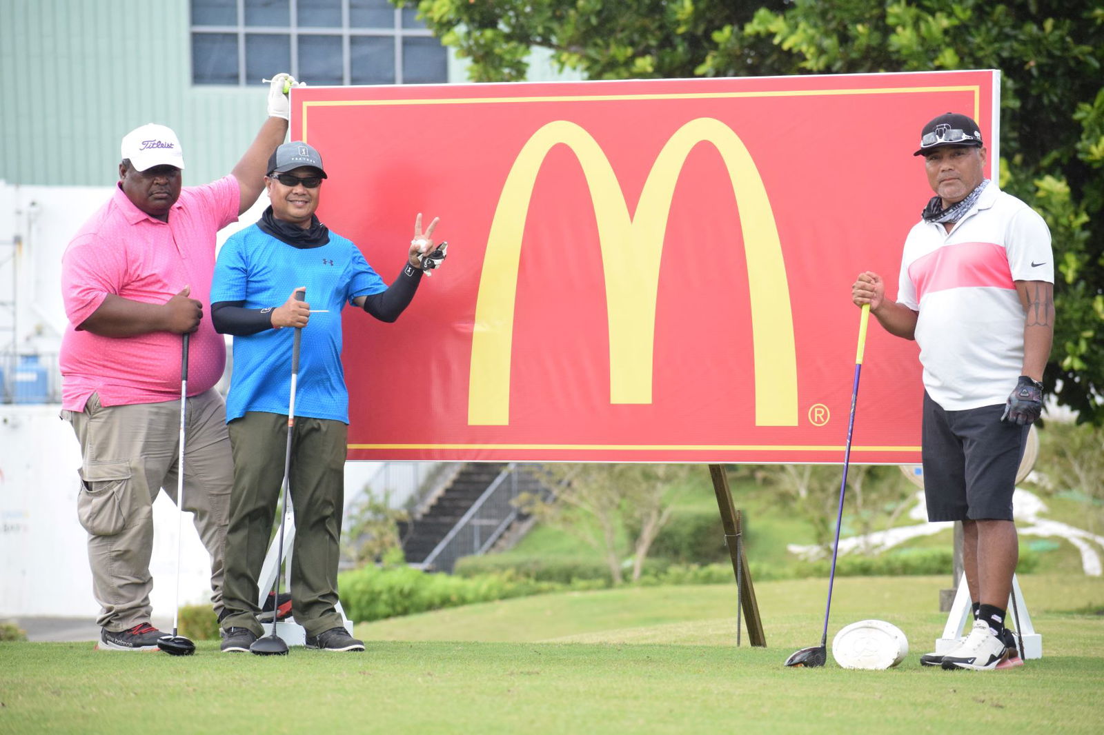Paul Kaipat, Freddie Cataluna and Marco Peter pose before teeing off on Hole No. 1.