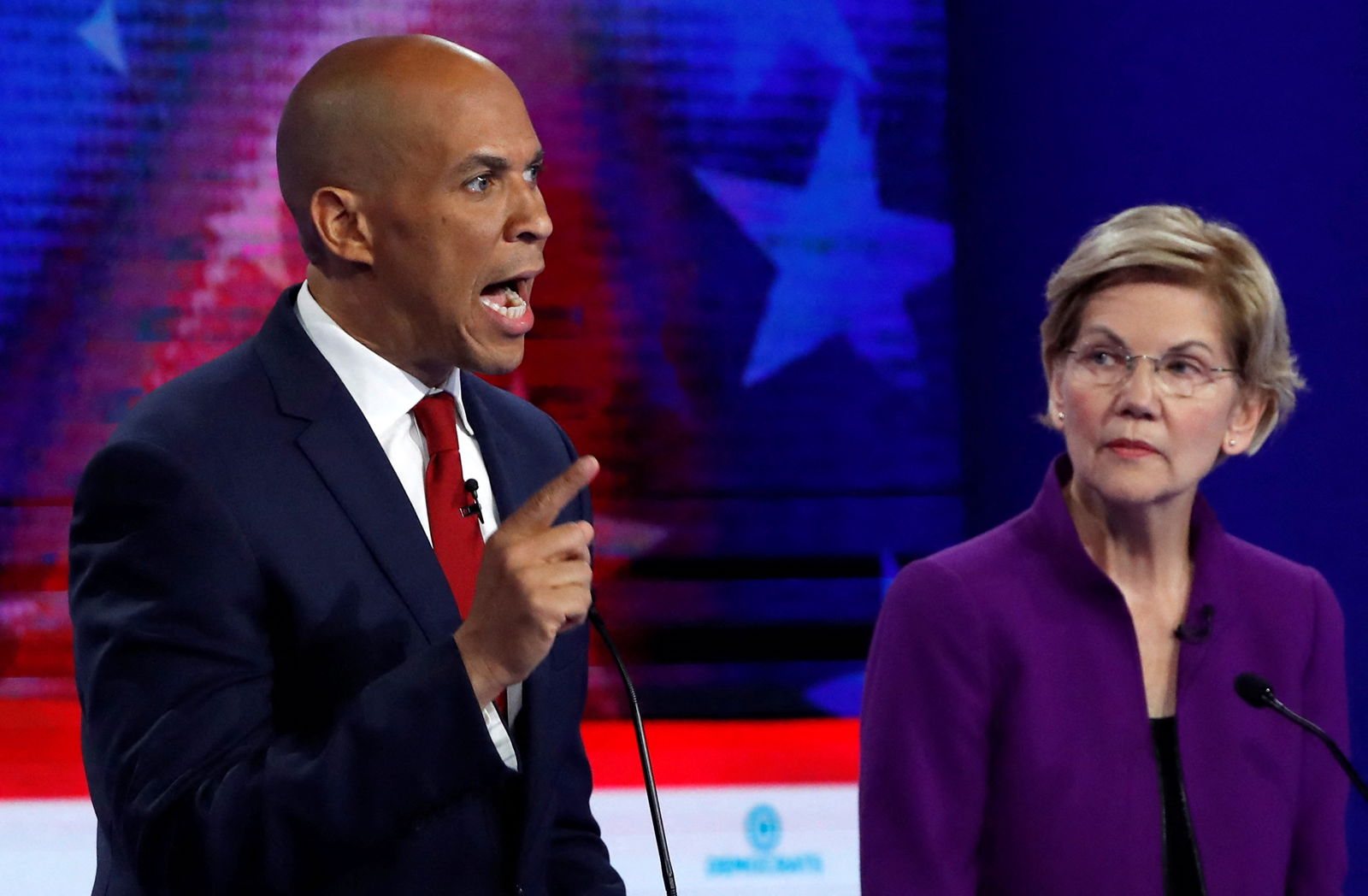 U.S. Sen. Cory Booker speaks as U.S. Sen. Elizabeth Warren listens during the first U.S. 2020 presidential election Democratic candidates debate in Miami, Florida,  June 26, 2019.